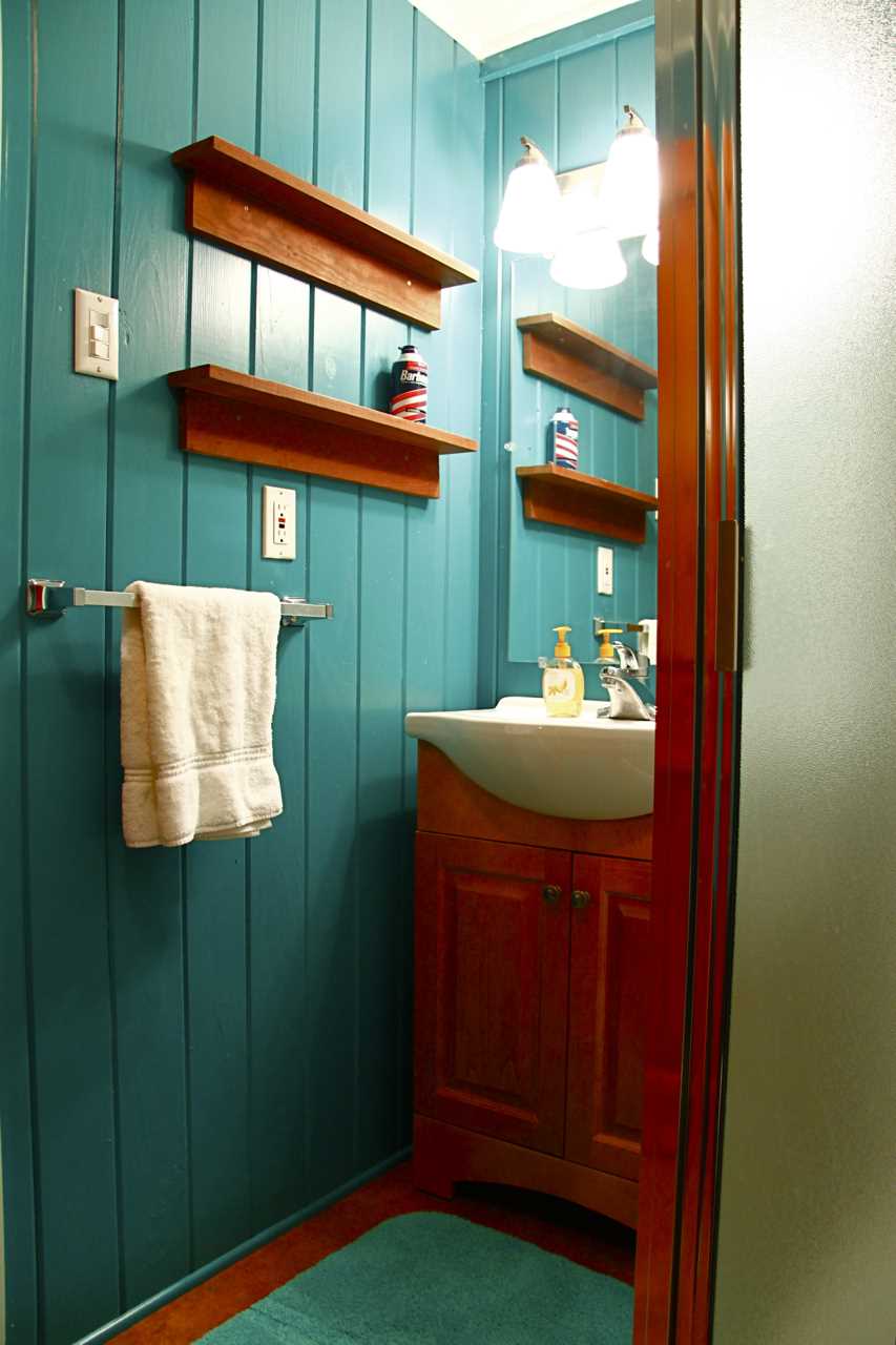                                                 A vibrant splash of color and plenty of shelf space for your toiletries help you feel at home, even in the bath!