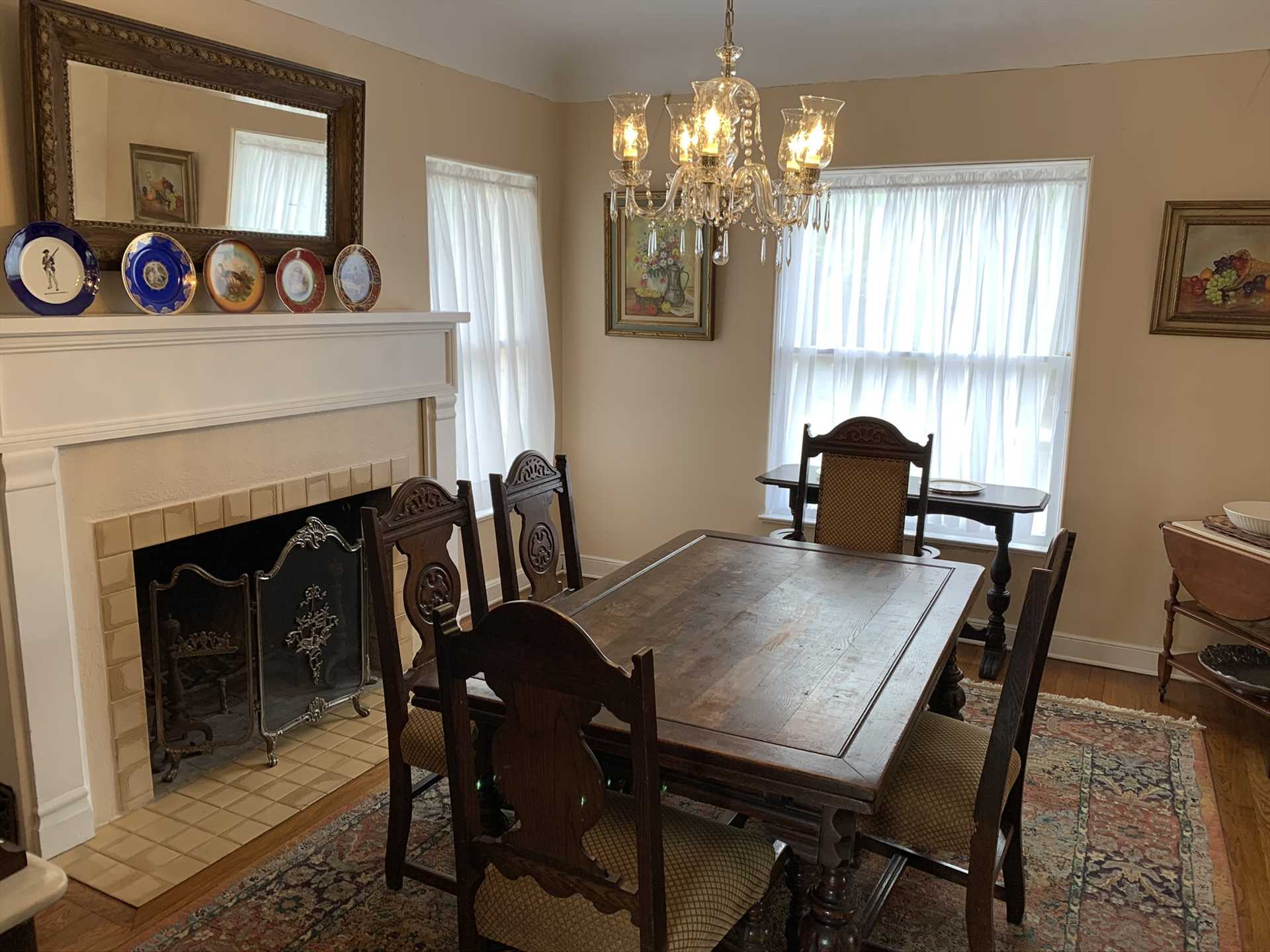                                                 Antique woodwork highlights the dining room, which offers a historic and homey setting for your family feasts.