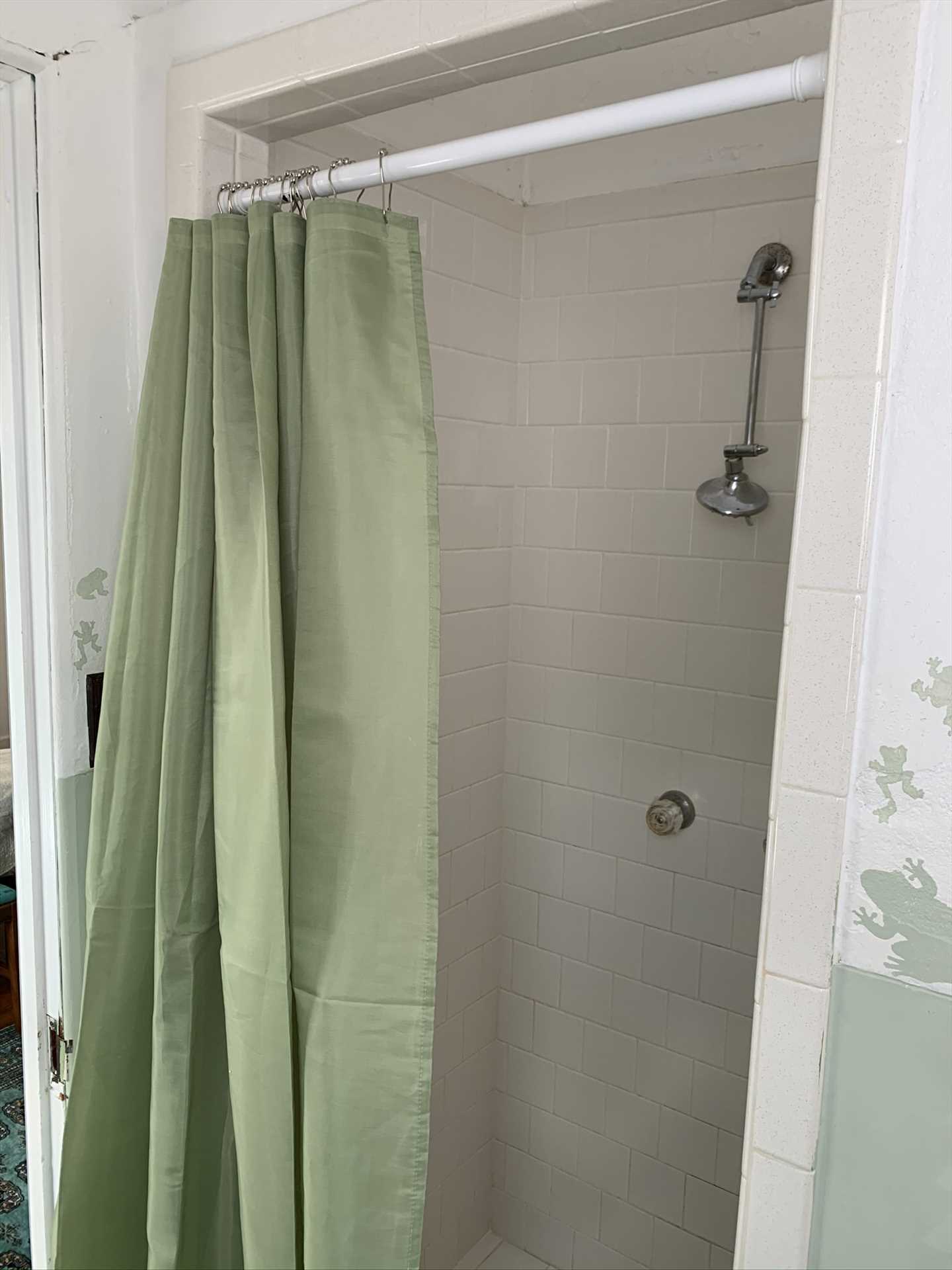                                                 Here's a look at the spotlessly-clean shower in the Jack & Jill bathroom. All the bathroom and bedroom linens your crew will need are provided.