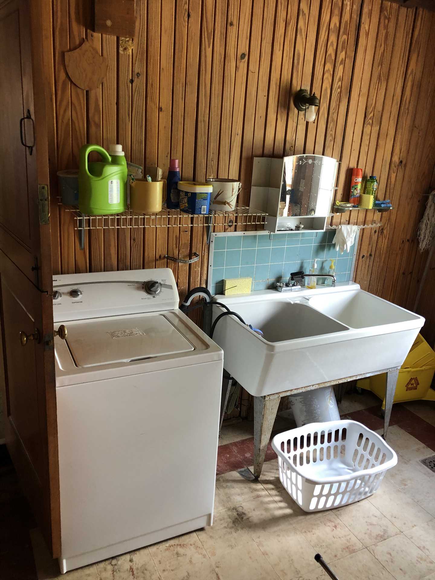                                                 The utility room includes a washer and dryer, and an industrial double sink, for your cleanup convenience.