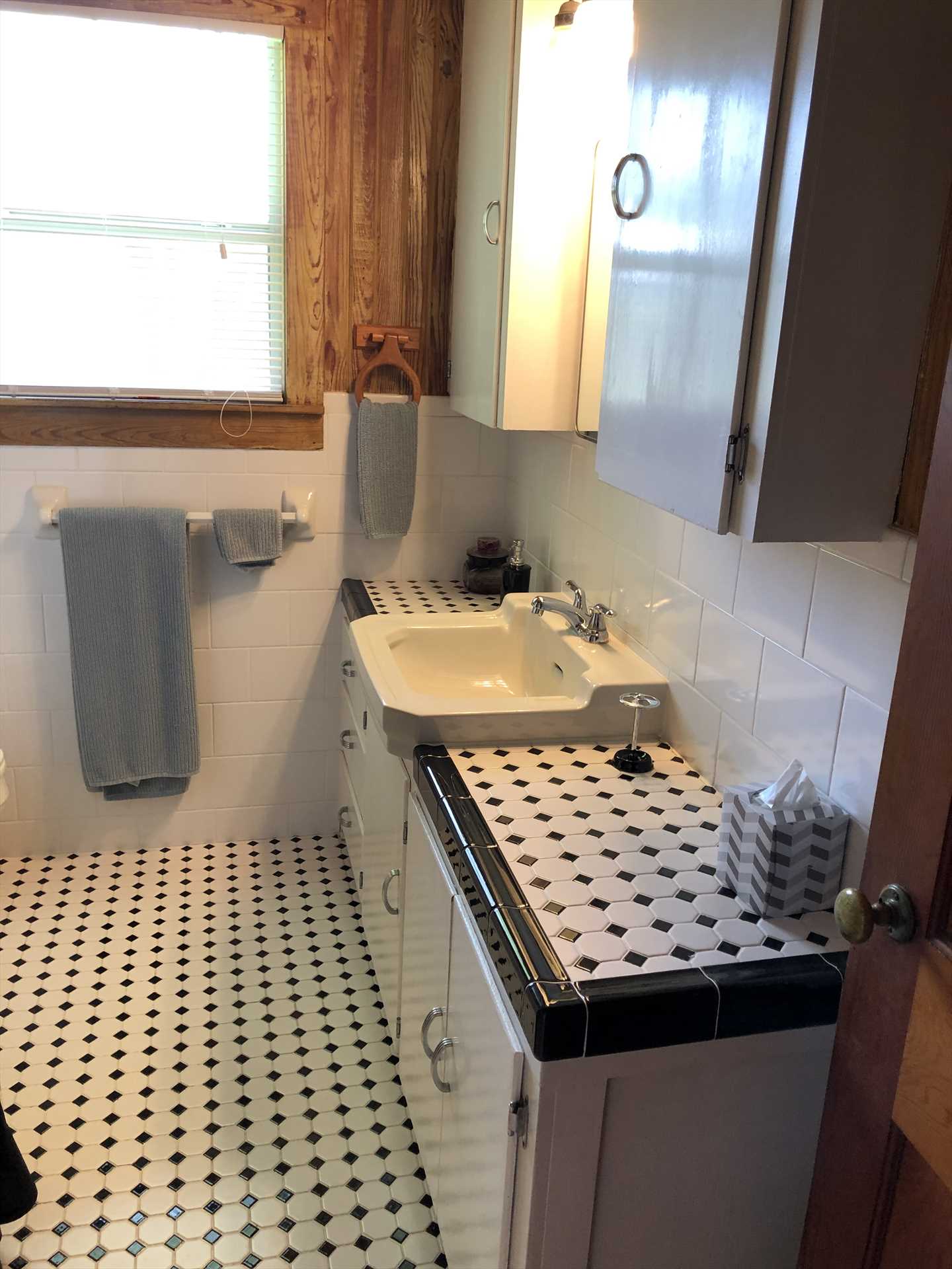                                                 The clean full bathroom features a shower and tub combo-and all the bathroom linens you'll need for your visit.