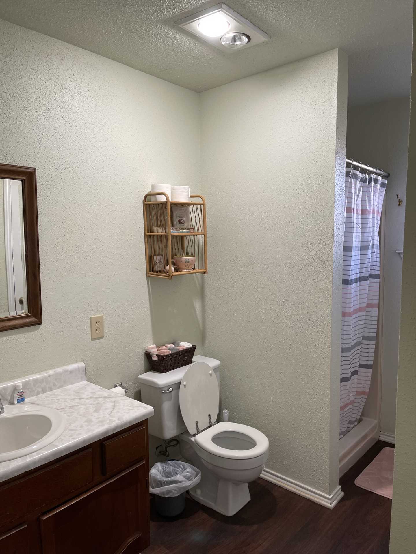                                                 The full bath is sparking clean, and features a large vanity and shower for cleaning up! Bath linens are included, too.