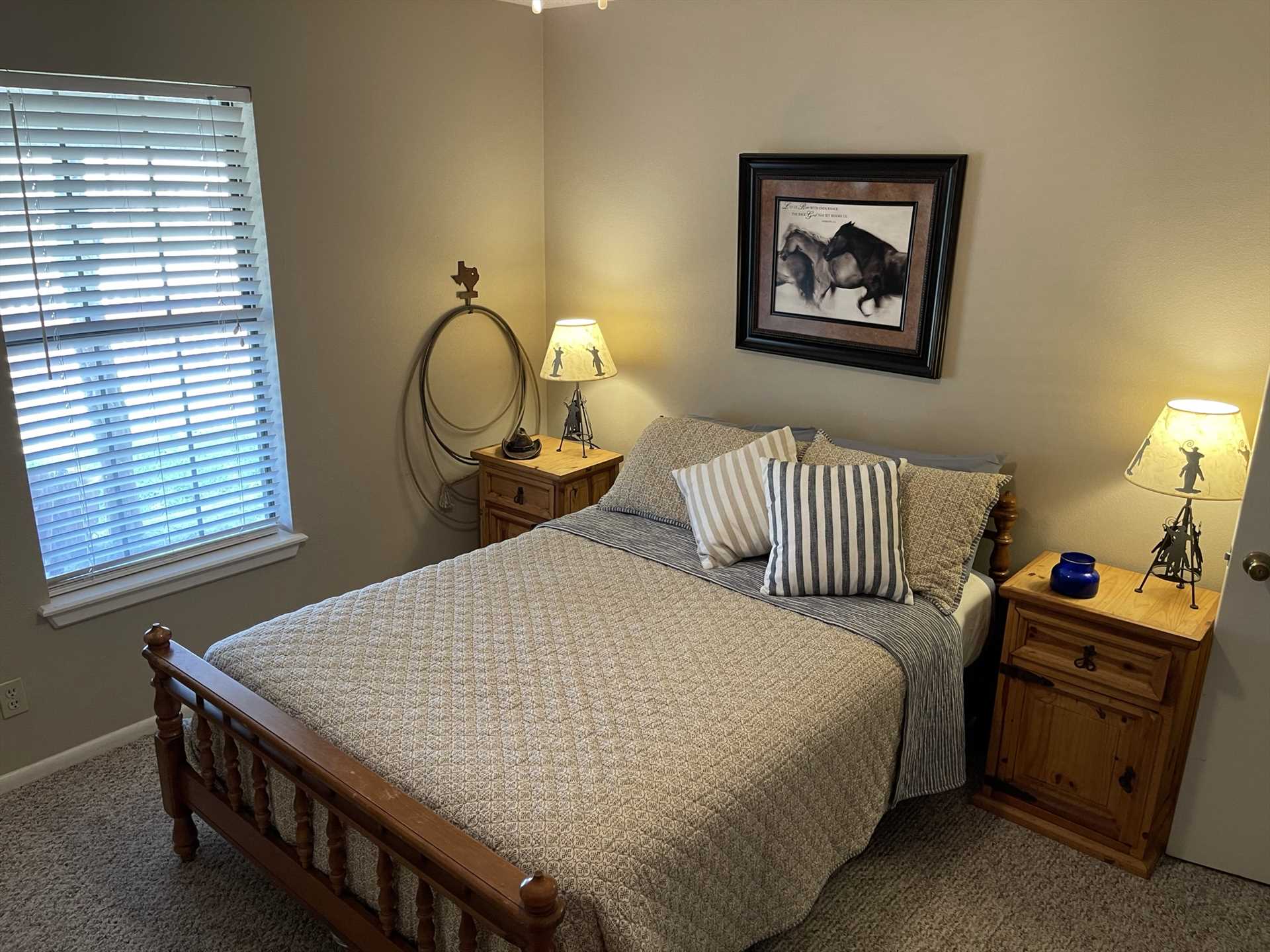                                                 A super-comfy double bed in the second bedroom invites peaceful slumber for two. All the beds in the Ranch House come with fluffy, clean linens.