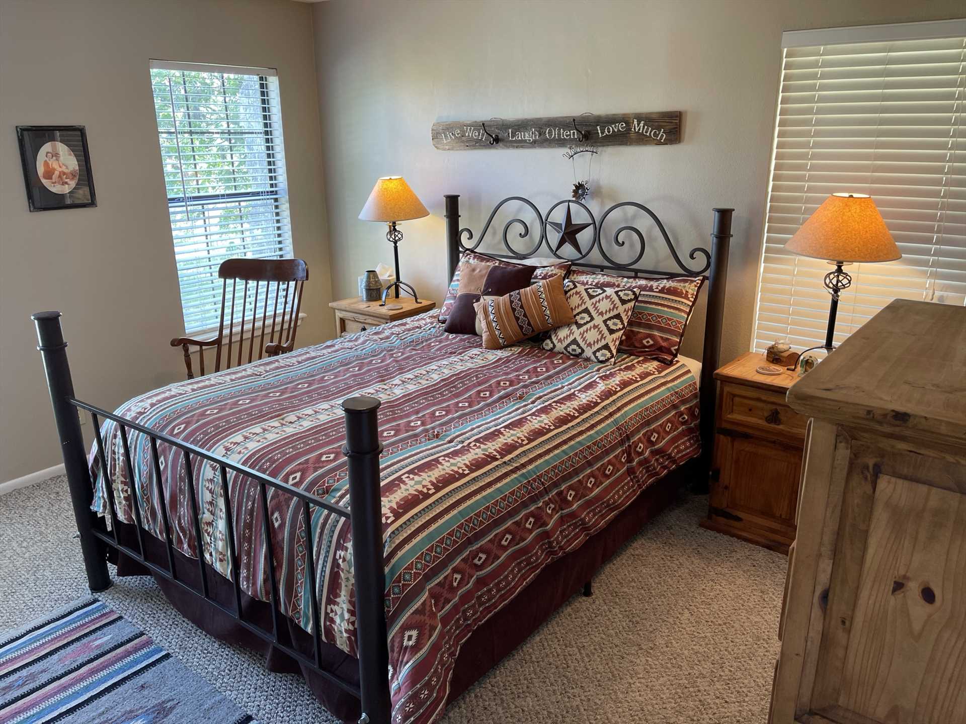                                                 Natural light fills the master bedroom, which features a truly Texan place to sleep: a soft double bed with a Lone Star headboard!