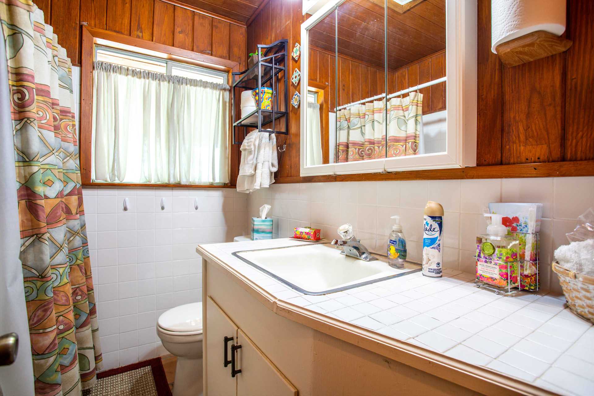                                                 The tidy second bath includes counter space for all your toiletries, so cleanup is quick,  and everything's handy!