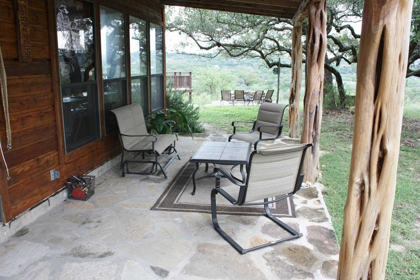                                                 Comfy outdoor furniture makes the shaded patio a great place for conversation and wildlife watching.