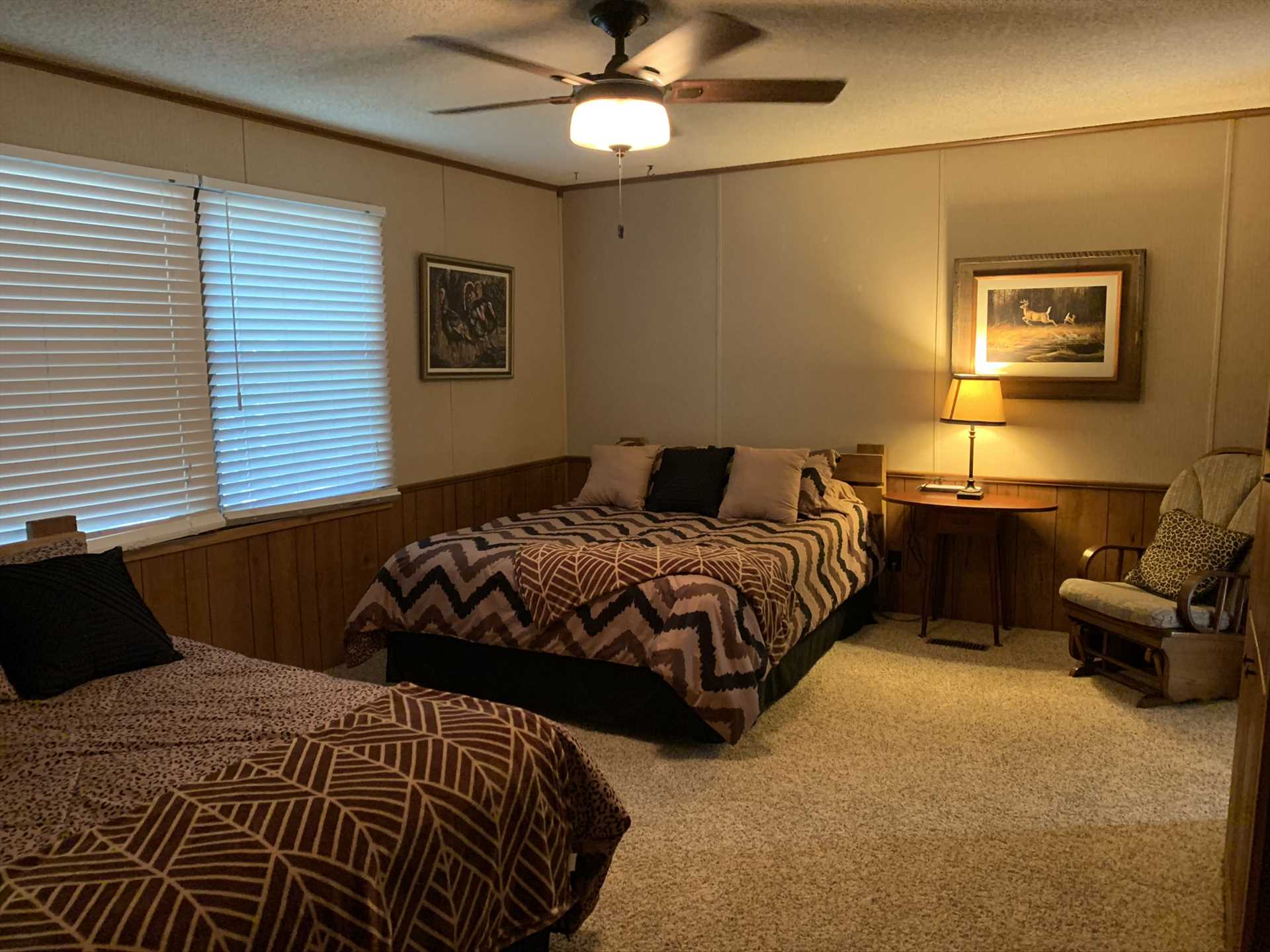                                                 Natural lighting fills the master bedroom with a warm glow, and two queen-sized beds provide restful sleep for four guests. Bed and bath linens are also provided throughout the Lodge.