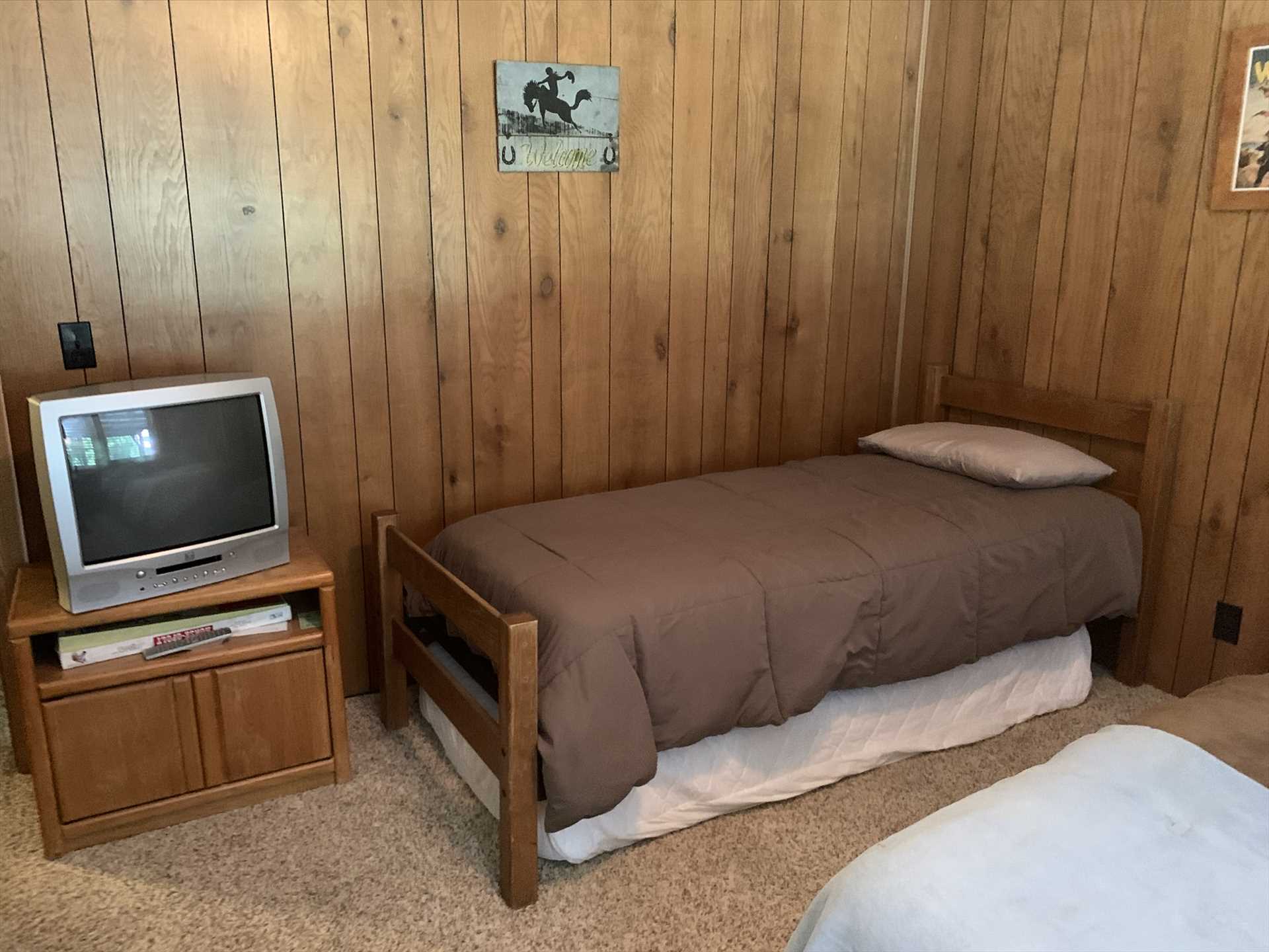                                                Cable TV highlights the second bedroom, and with a full bed and two twins, four more of your folks will have a prime sleeping space.