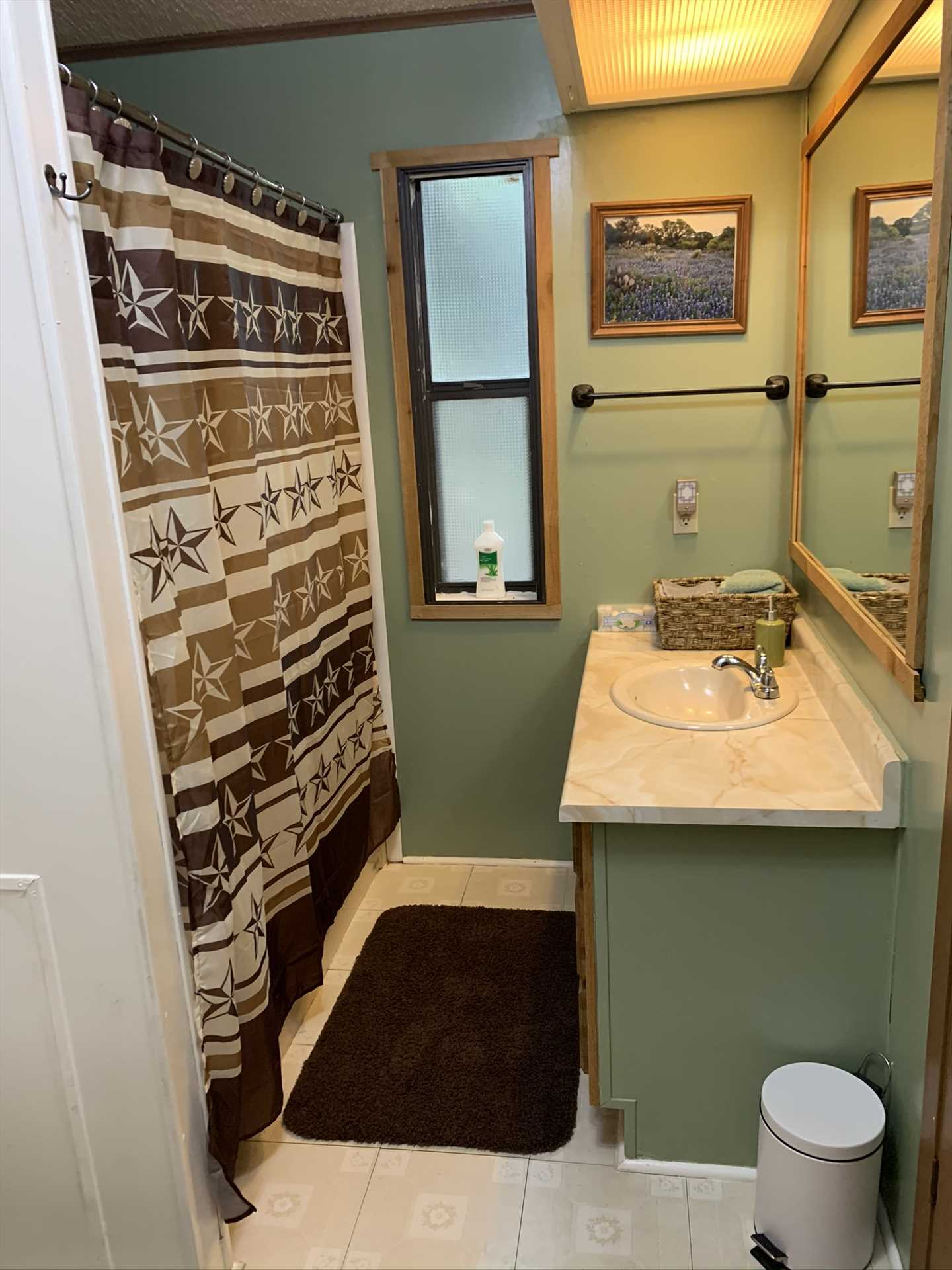                                                 A shower and tub combo, along with plenty of complimentary linens, can be found in the second bath.