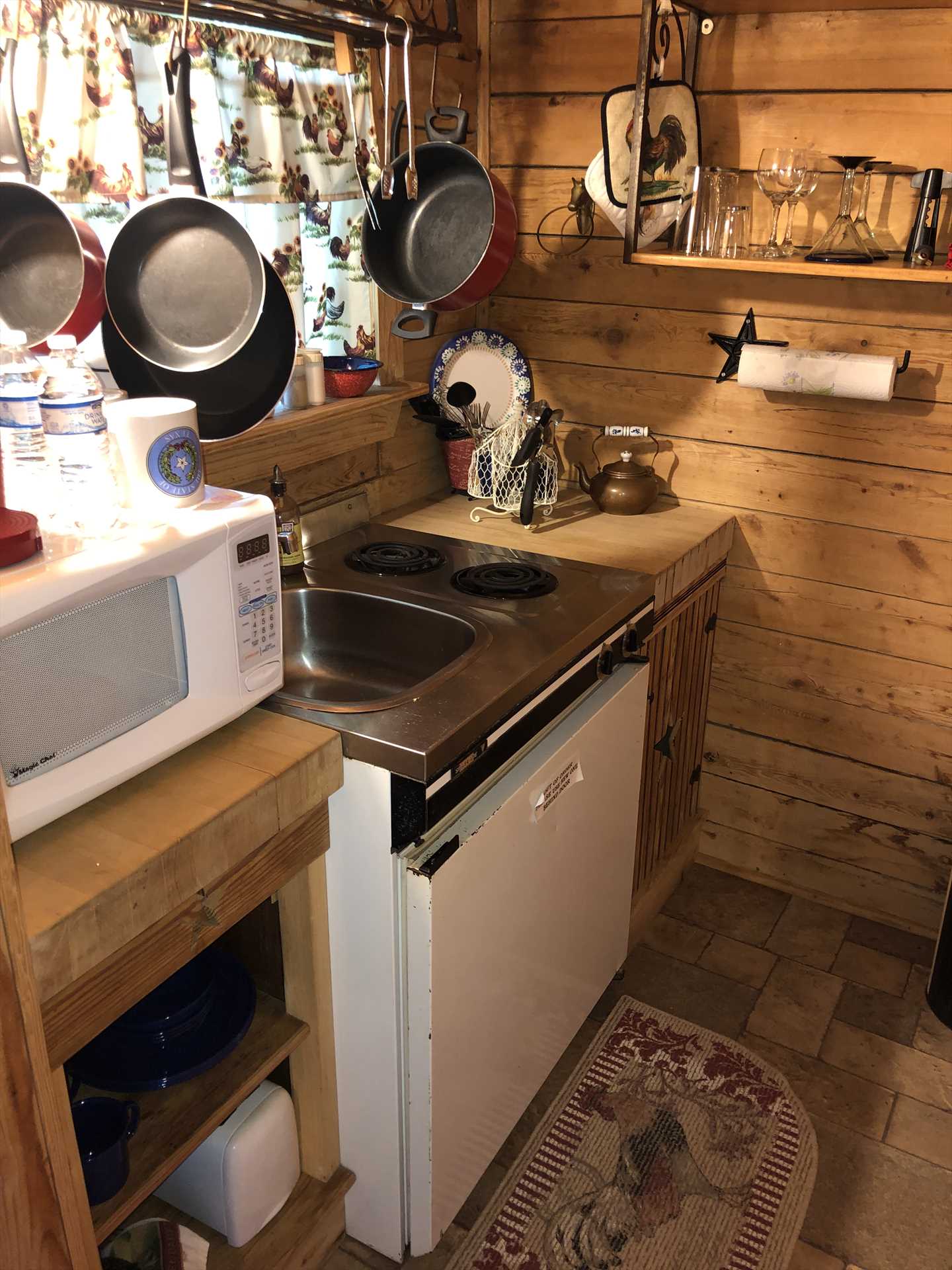                                                 The cozy kitchenette includes a fridge, stove, microwave and coffee pot. Be sure to check out the fresh-ingredient offerings at the Backyard Bistro, too!