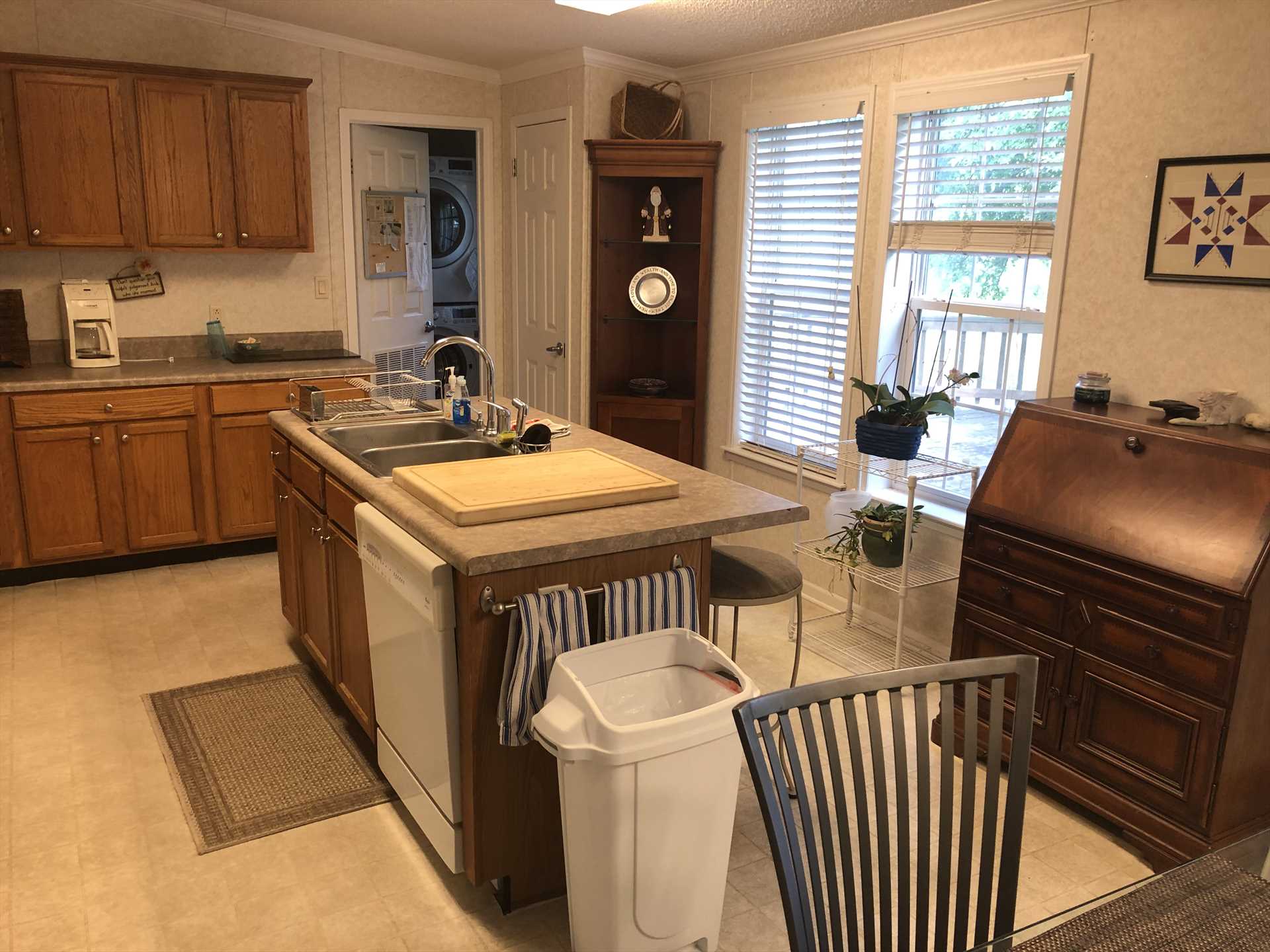                                                 Beyond the fully-appointed kitchen, you'll see a new washer and dryer combo installed for your convenience!