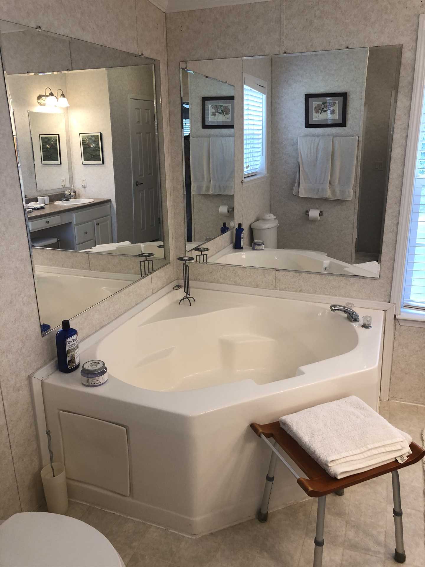                                                Sink into some soothing suds in the enormous custom tub in the master bath! There's a shower here, too, for quick and easy cleanup.
