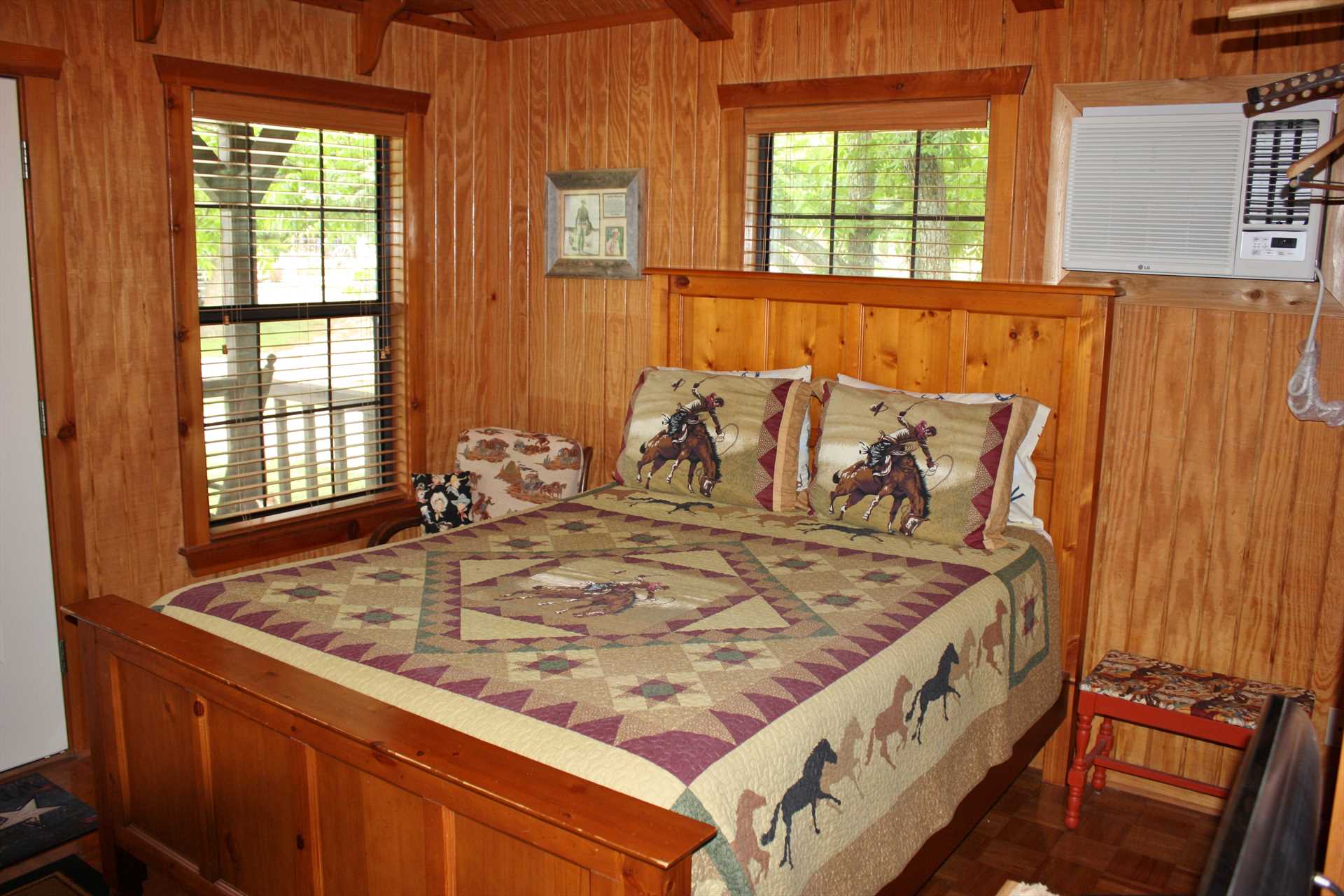                                                 The framework of the huge and comfy queen bed matches the gorgeous woodwork you'll find throughout the cabin.