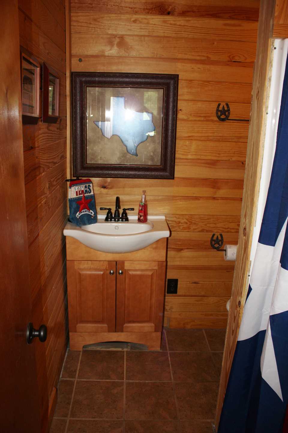                                                 The spotlessly-clean full bath features a shower stall, and equally clean bed and bath linens are included.
