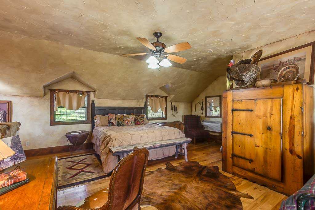                                                 The roomy master bedroom features a huge king-sized bed and a twin. All the beds in the Ranch House come with clean and soft linens.