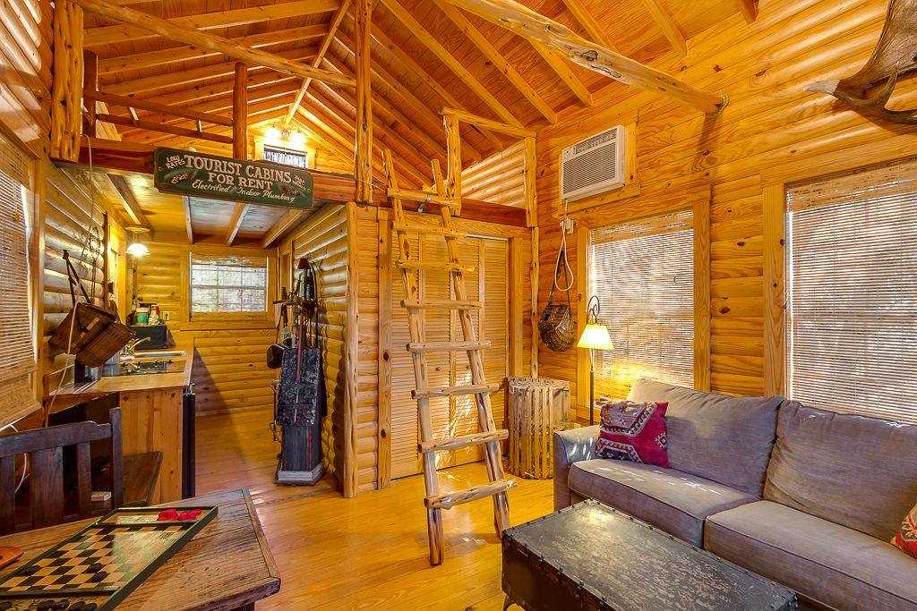                                                 All that glitters may not be gold, but the glowing woodwork lends a vibrant energy to the cabin's interior. You'll also enjoy the added comforts of AC and satellite TV!