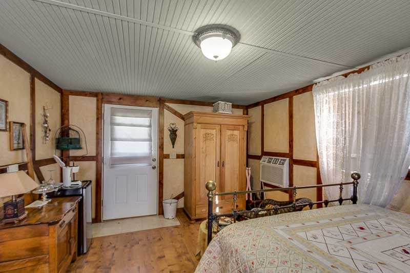                                                 This lover's cottage comes with climate control, cable TV, and you'll even find complimentary beverages in the mini fridge!
