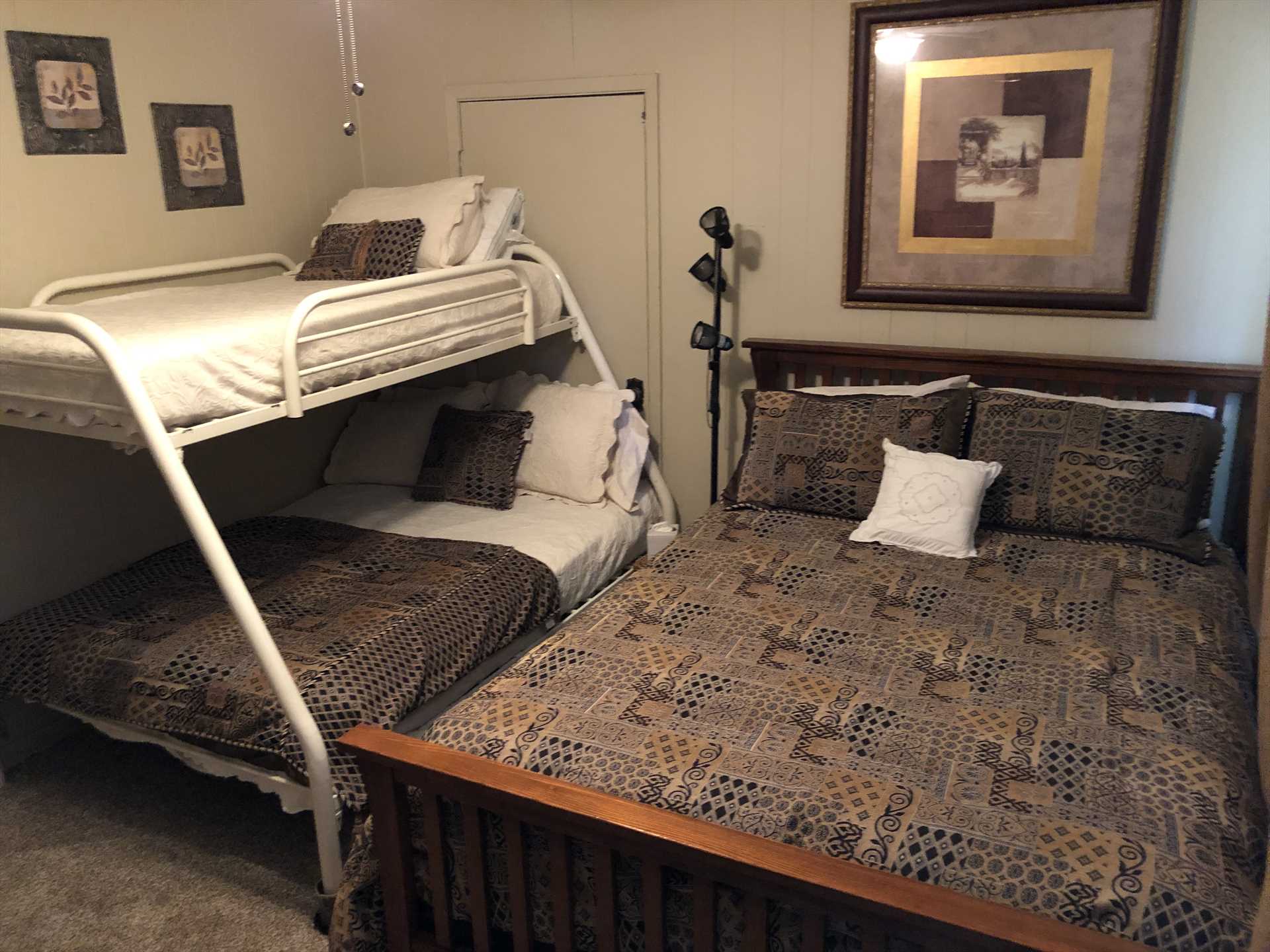                                                 Up to five guests can sleep peacefully in the third bedroom, with a queen bed and a double down/twin up bunk bed. This space serves perfectly as a kids' room!