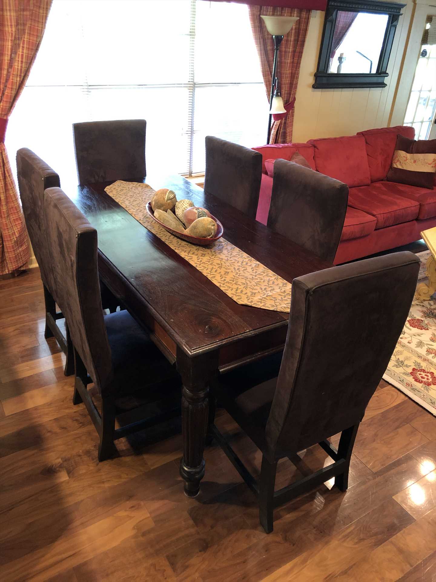                                                 Seat yourself and dig in around the delightful dining room table!