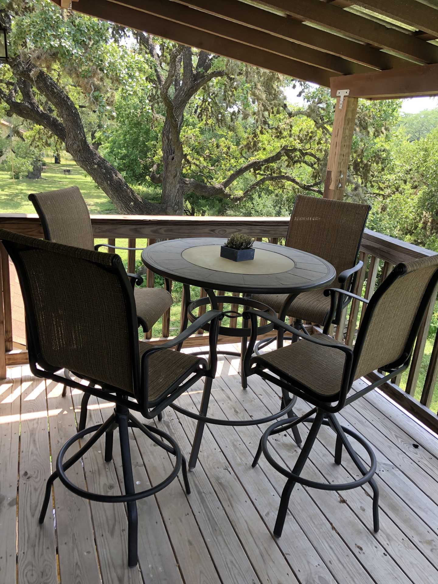                                                 Conversation and relaxation are yours whenever you'd like in the comfy patio furniture on the shaded deck.