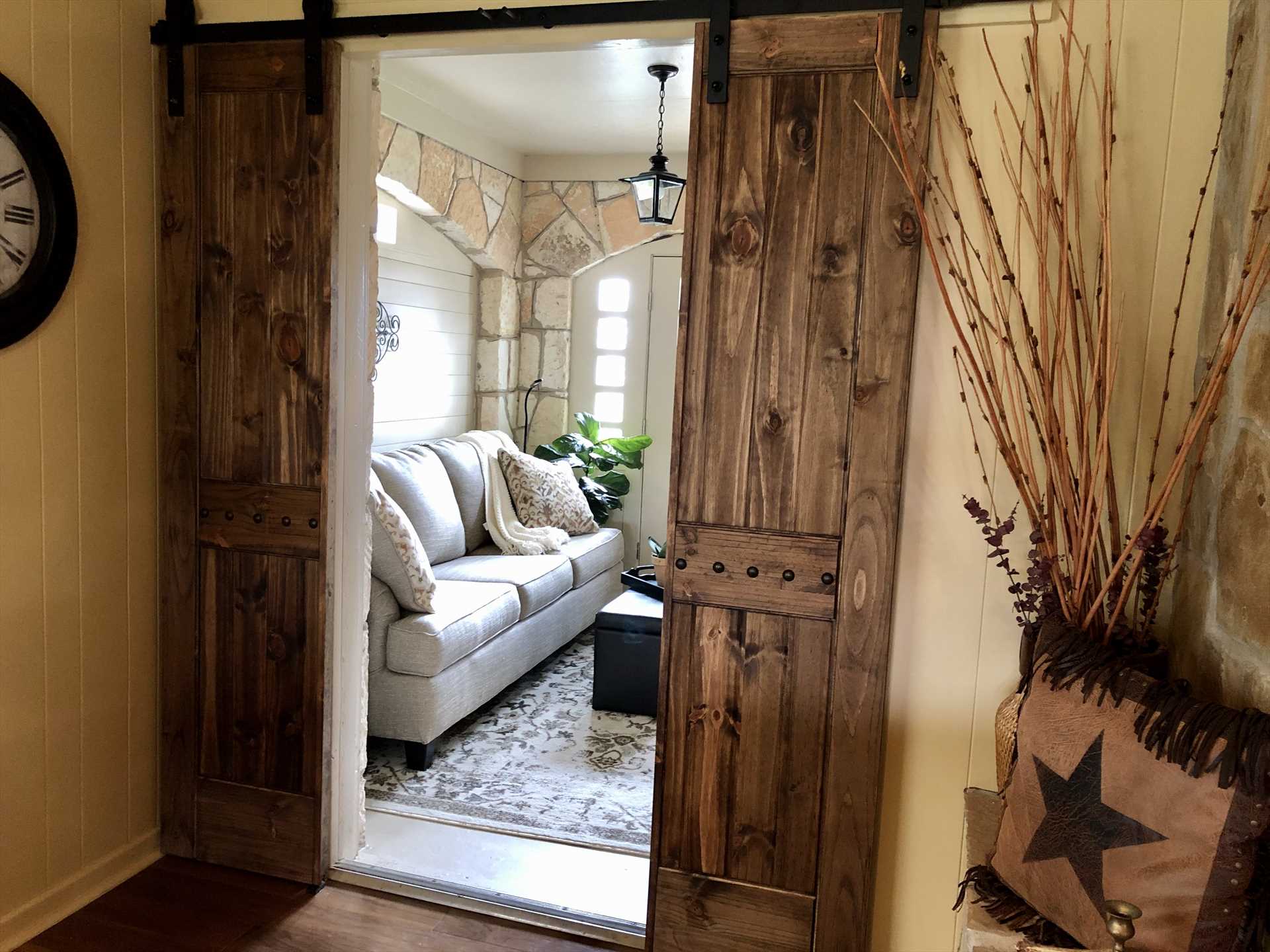                                                 The barn door access to the foyer is just one of the homey touches that gives the guest house a personality all its own.