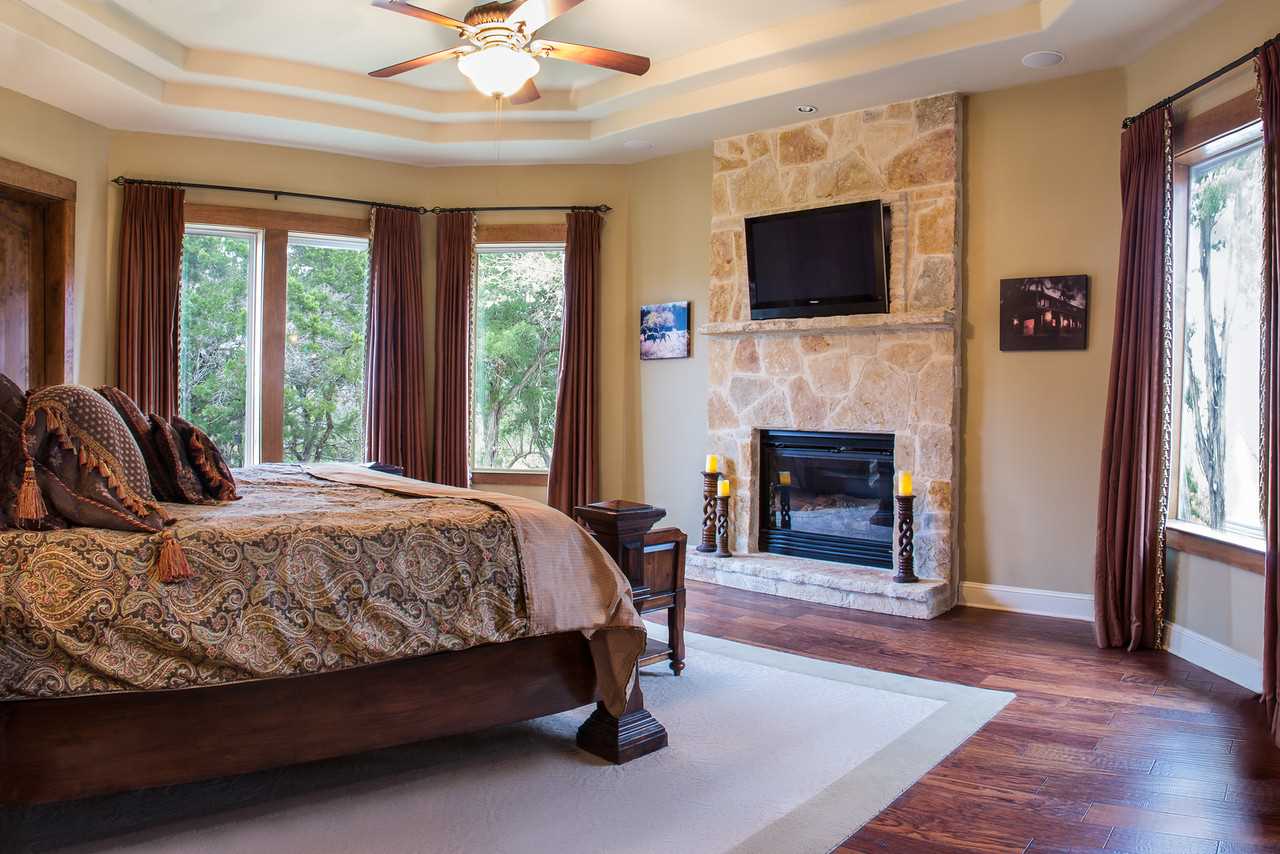                                                 Rest like royalty in the grandeur of the master bedroom, furnished with a fireplace and king-sized bed! All sleep accommodations here come with clean and soft linens.