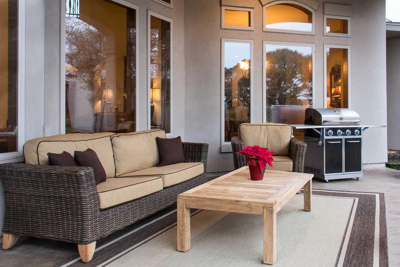                                                 The huge patio serves as a second living area all its own, with super-comfy furniture and a gas grill for BBQ enthusiasts.