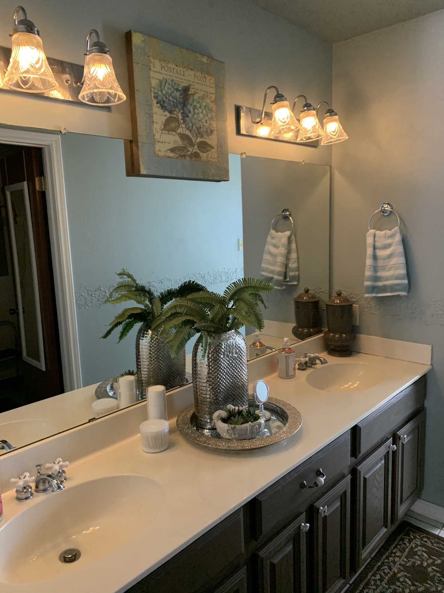                                                Along with a roomy double vanity, the master bath comes with clean and fluffy bath linens, as well (as do all the baths here).