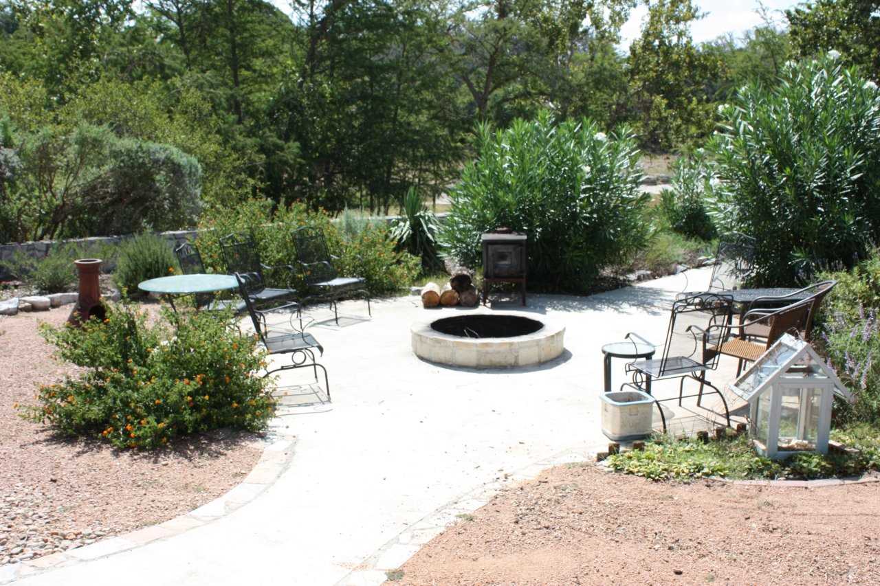                                                 With a fire pit and charcoal grill on the back patio, you'll have no end of options for snacks and meals! Wildlife viewing and stargazing are awesome back here, too.