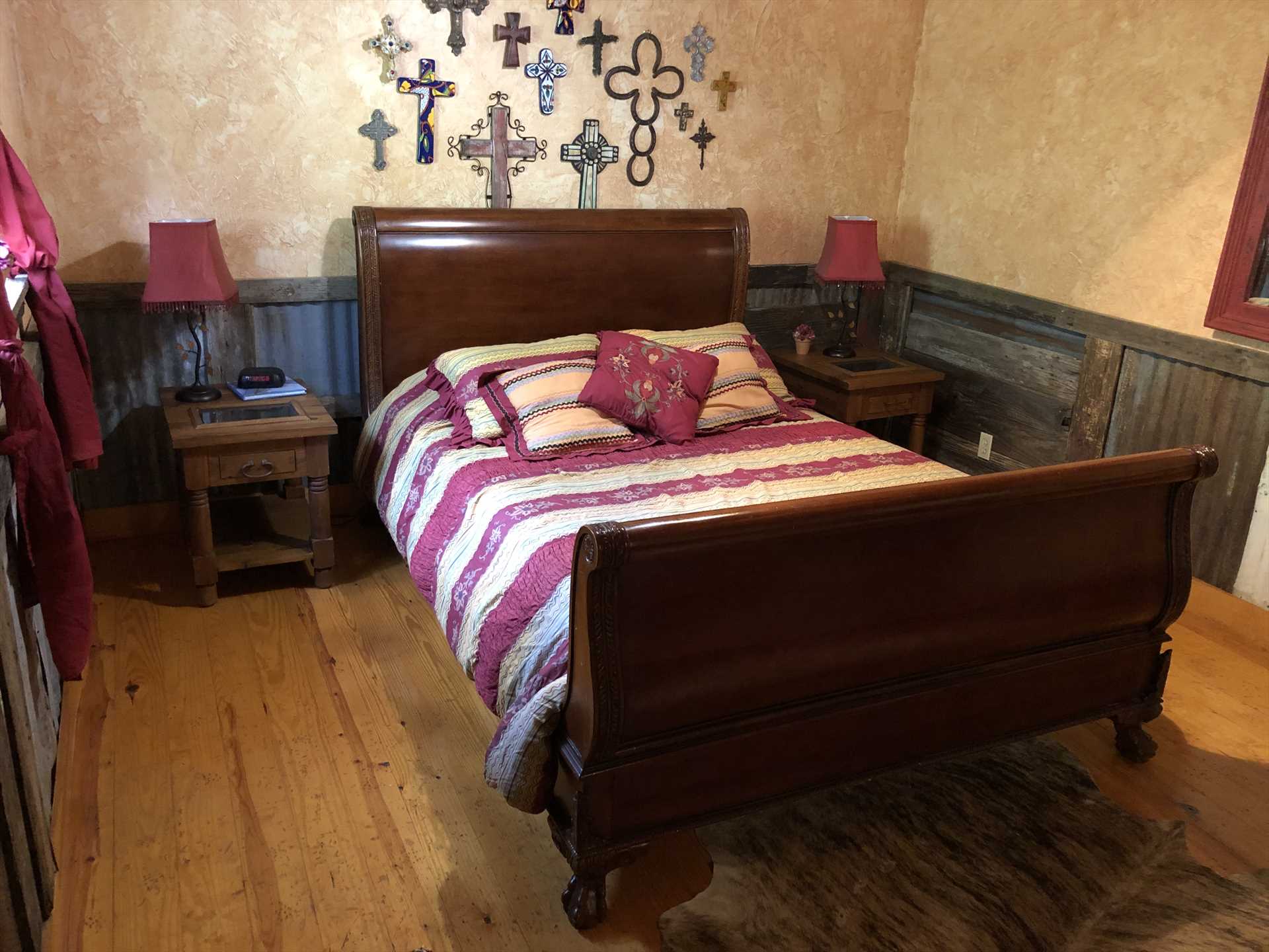                                                 The master bedroom's queen-sized sleigh bed is like sinking into a cloud!
