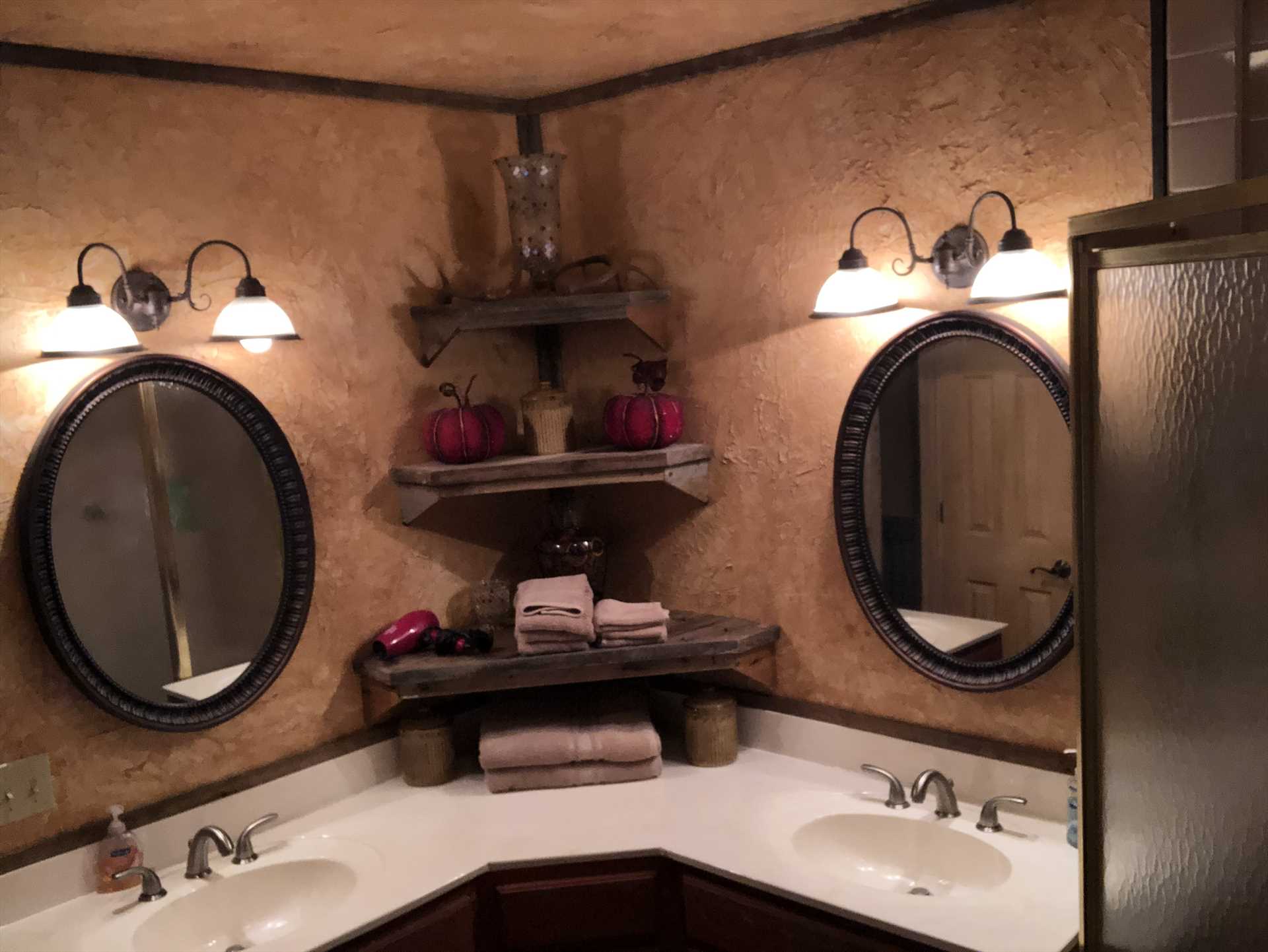                                                 Twin vanities and a roomy shower stall round out a master bedroom fit for royalty!