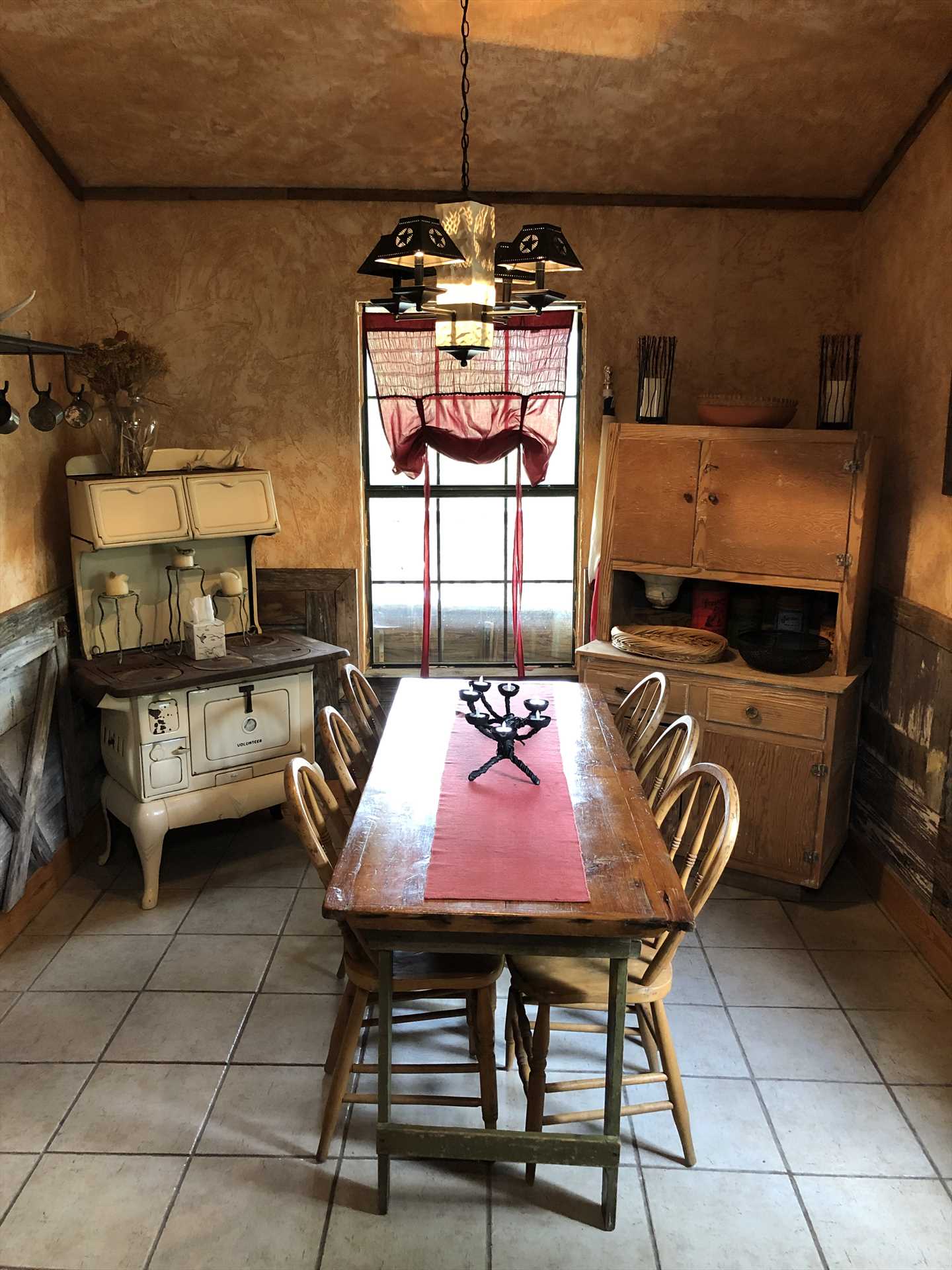                                                 You can almost hear the nostalgic clang of the dinner bell calling you to this wonderful country kitchen!