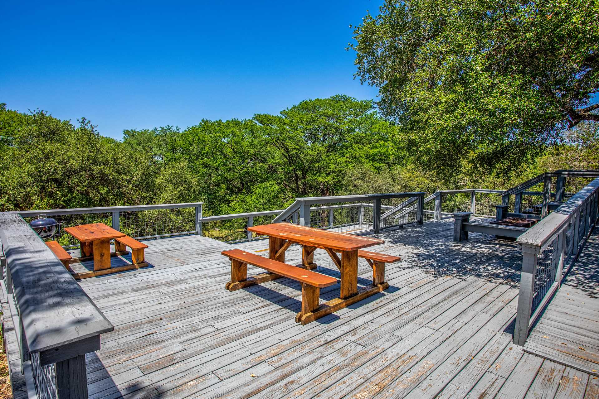                                                The two-level deck here is HUGE, with plenty of room for everyone to admire the mountain views, stargaze, and simply enjoy great company!