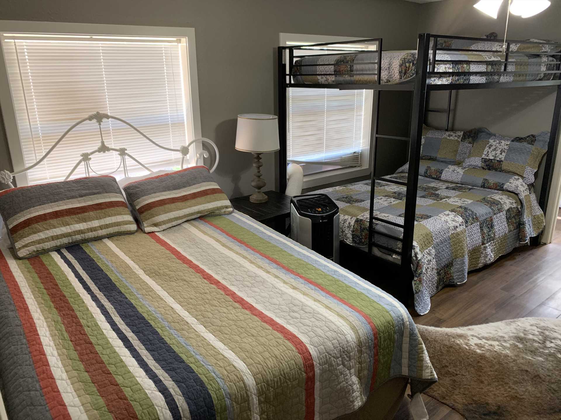                                                 The second bedroom comfortably sleeps up to five with a queen bed, and a bunk-style setup with a double under and a twin up top.