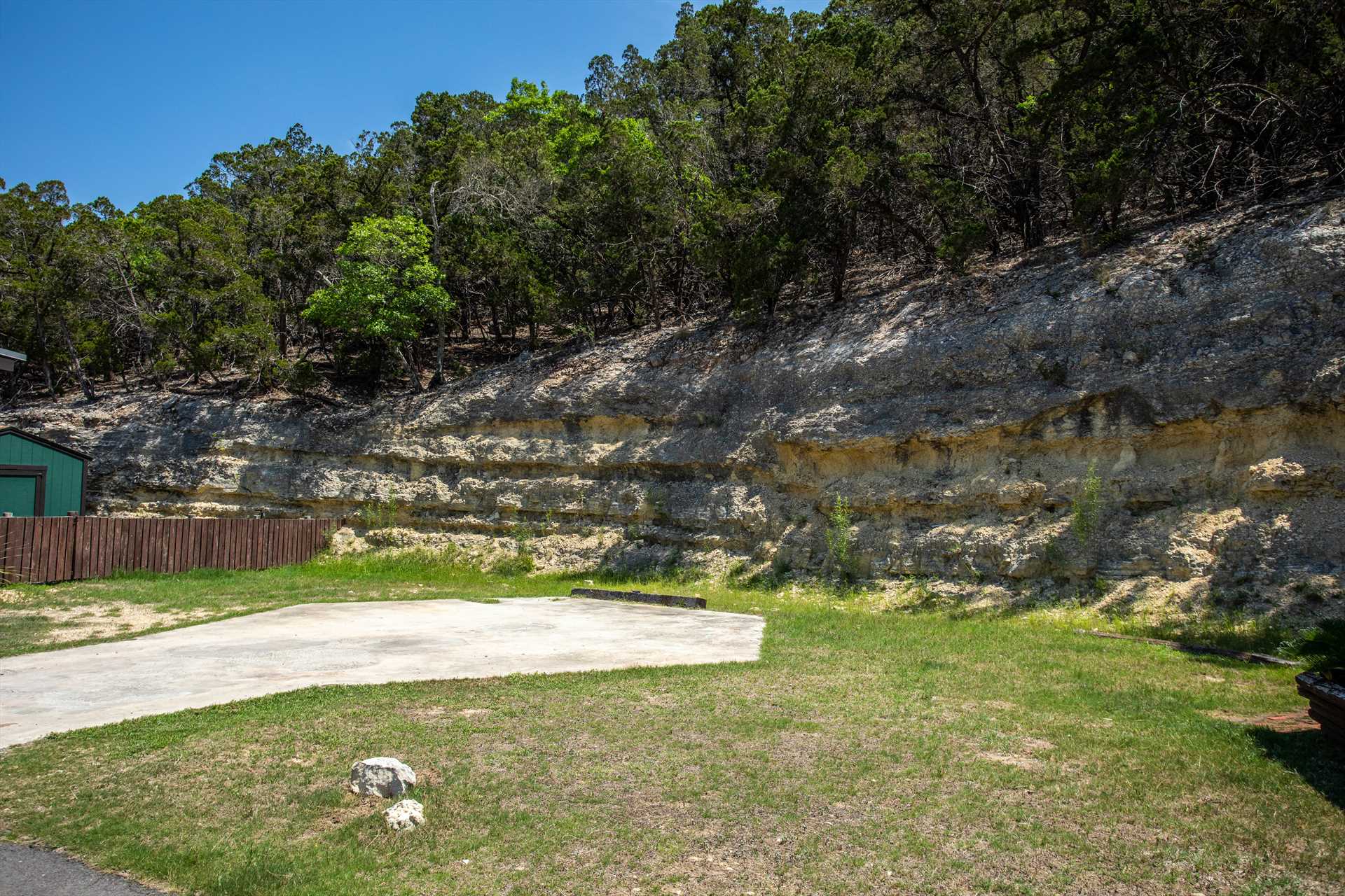                                                 Majestic limestone cliffs bracket the Antler Run Ranch Cabin with gorgeous Hill Country views!