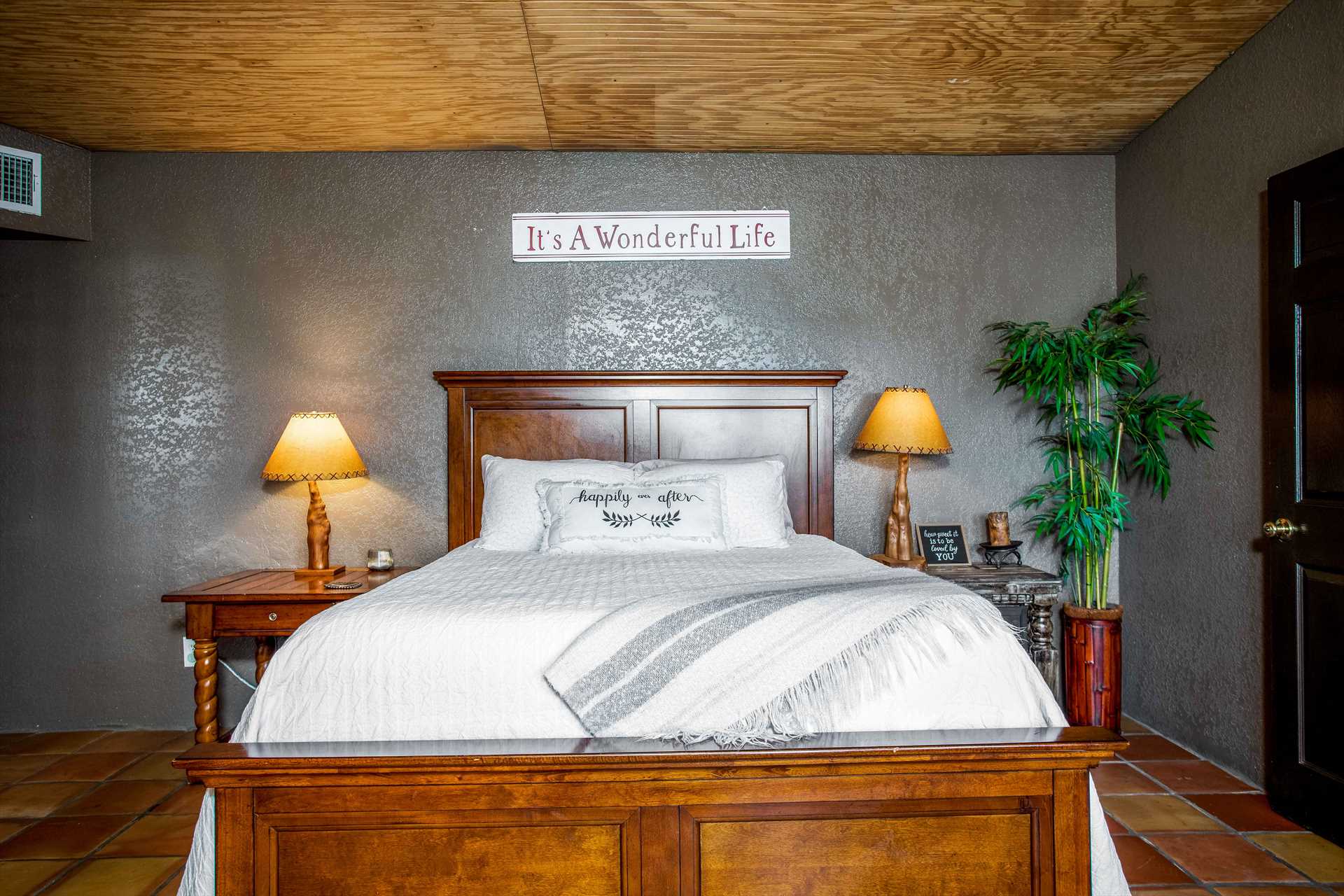                                                 The stately wood-framed queen-sized bed comes complete with fresh and clean linens for the duration of your visit with us.