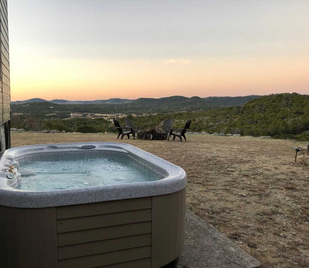                                                 Slip into the hot tub with a glass of wine, and take in the multicolored dazzle of a Hill Country sunset.