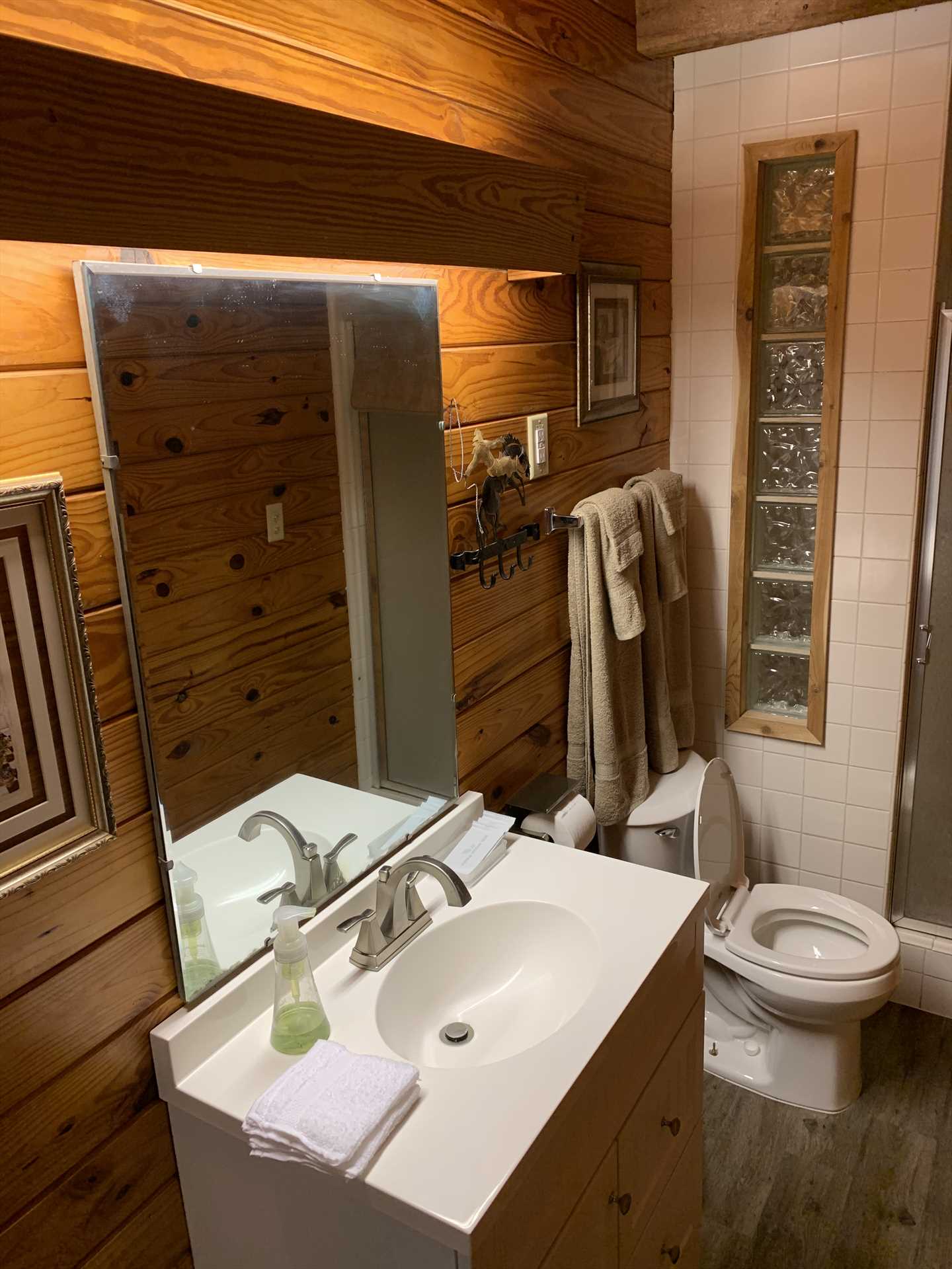                                                 Rustic woodwork and clean and modern amenities make even the bathroom a memorable space! All bath linens are included with your rental, too.