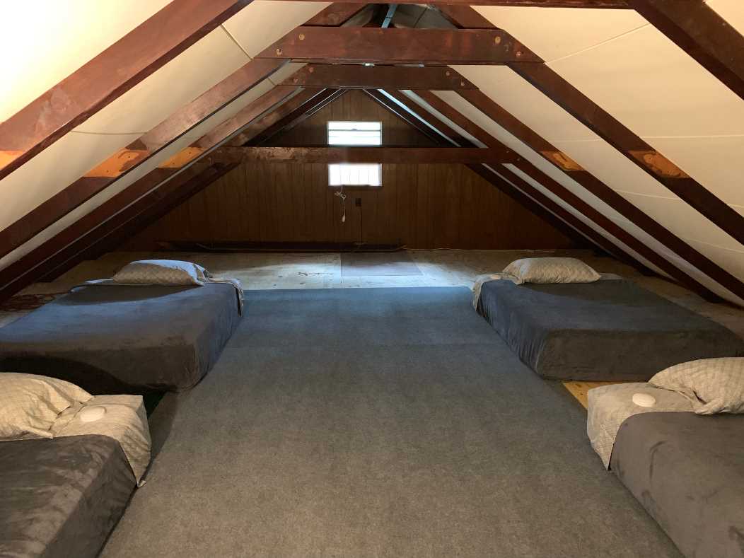                                                 At the top of the spiral staircase lies the loft, equipped with four twin beds. This is a great space for kids to enjoy!