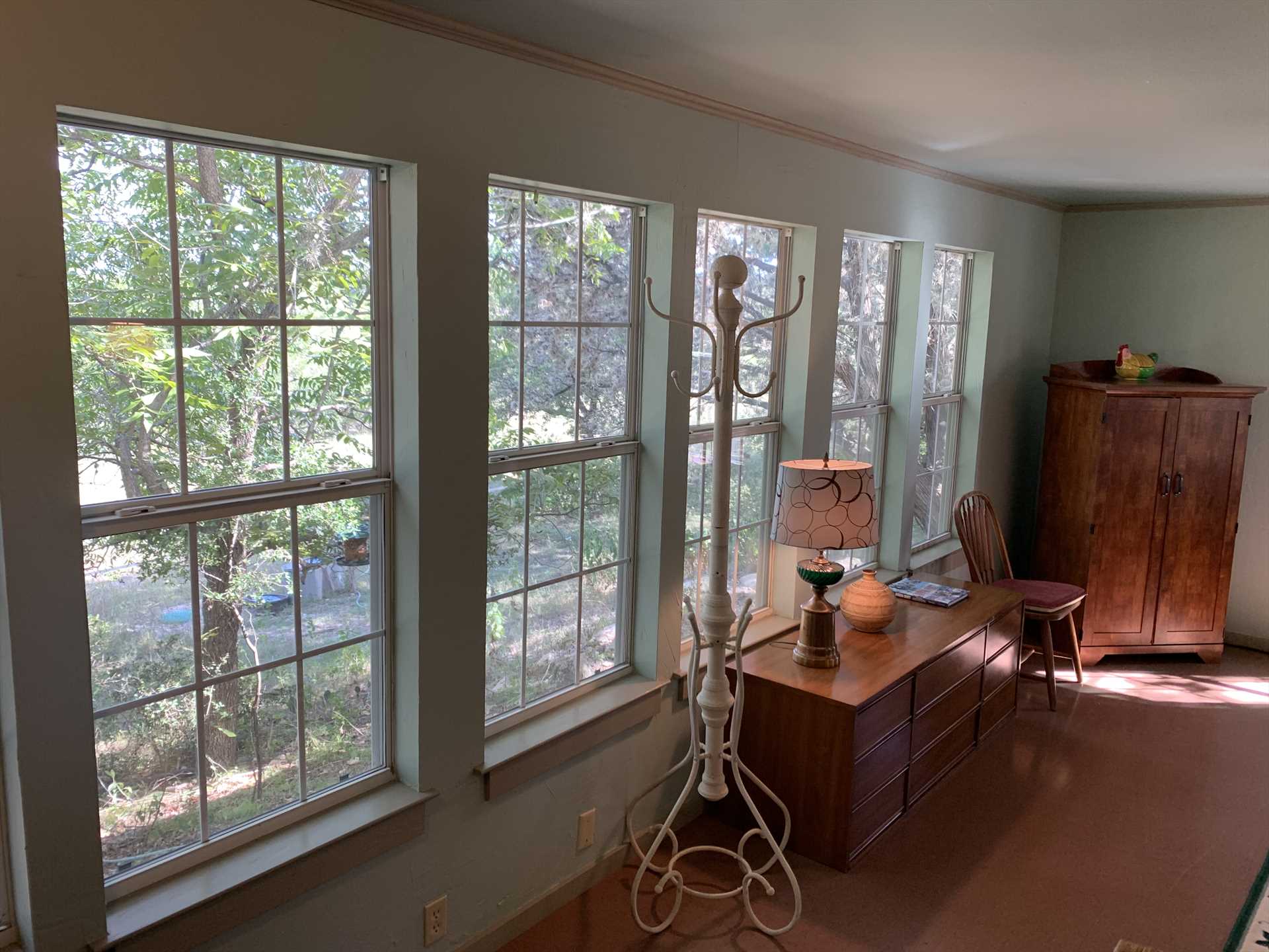                                                 Plenty of windows and mellow woodwork create a soothing and welcoming ambience.