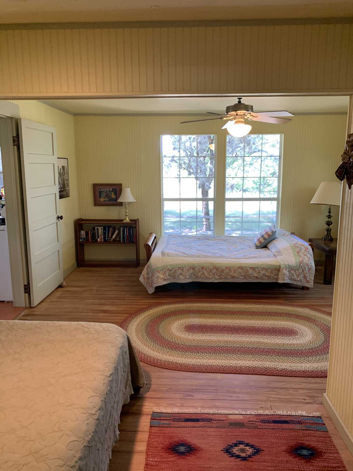                                                 Restful slumber will greet you in the main bedroom, furnished with both a queen and full bed.