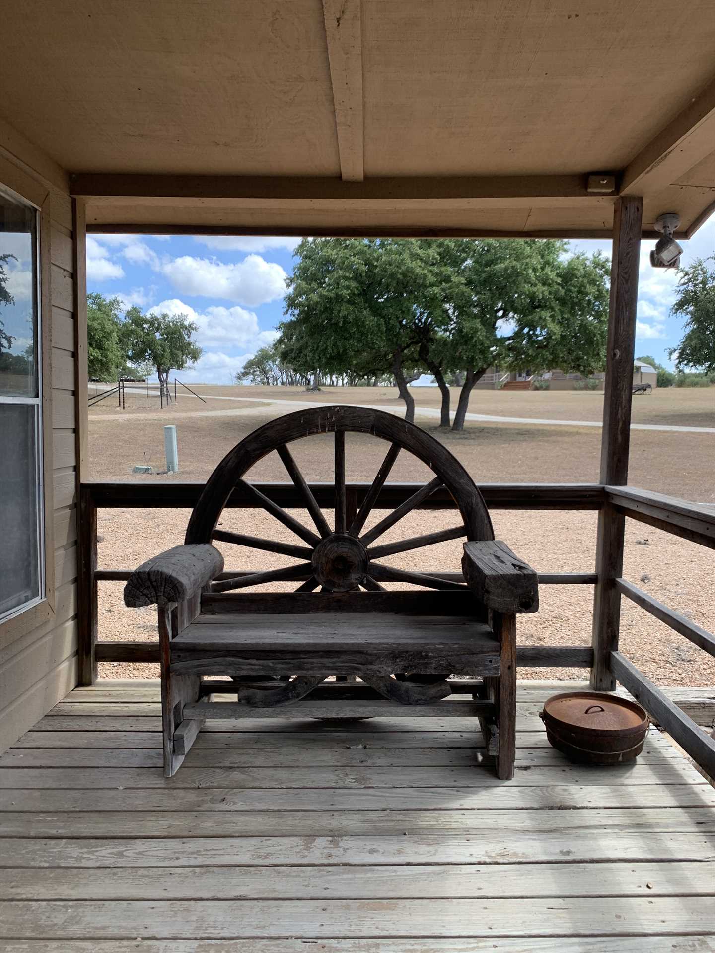                                                 Relaxing shaded spots and touches like the wagon wheel decor at the pavilion make Tabasco Ranch a truly Texan experience.