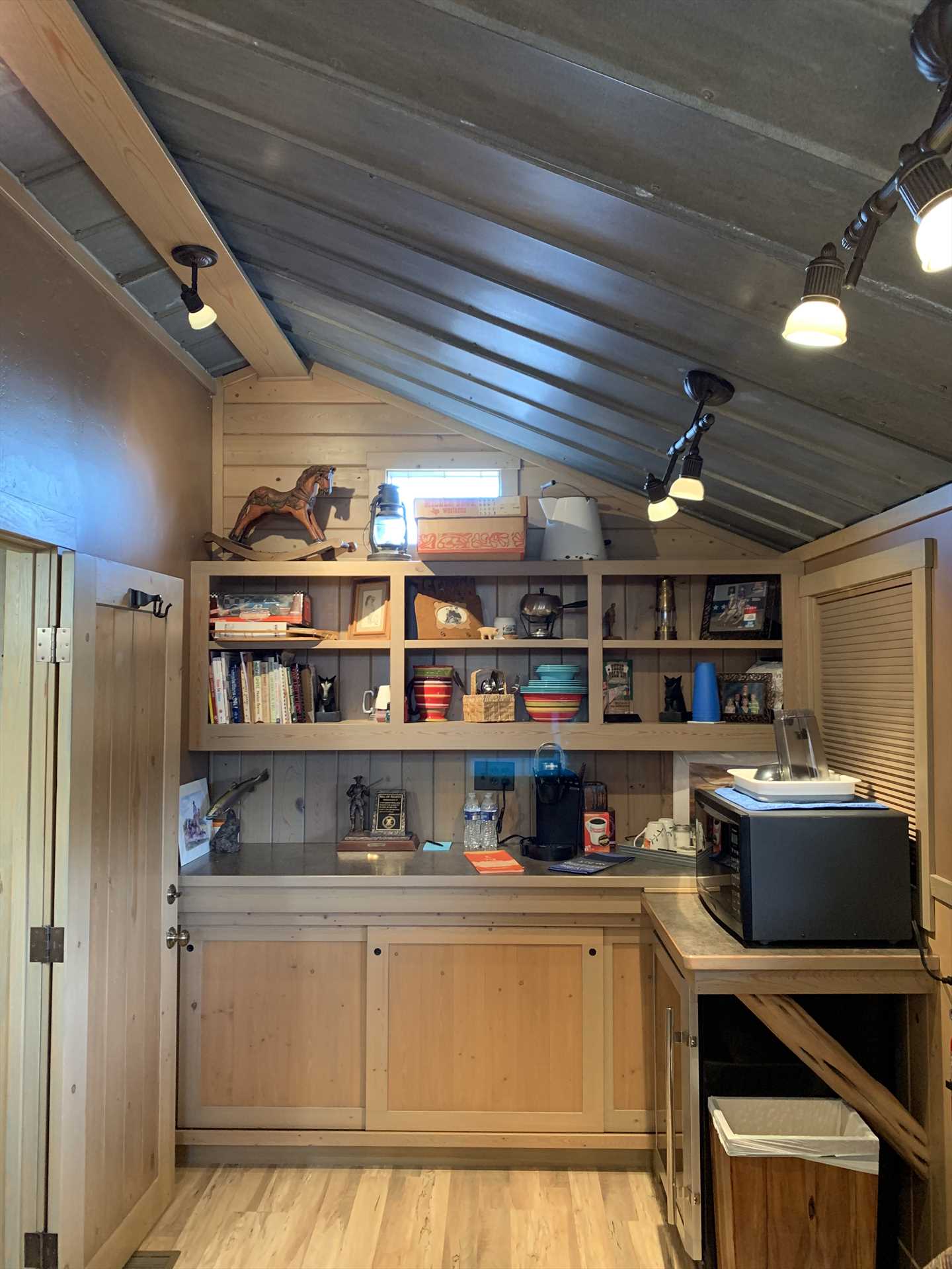                                                 Coffee basics, a microwave, and mini fridge round out the cozy kitchenette. For more cooking space, check out the shared pavilion!
