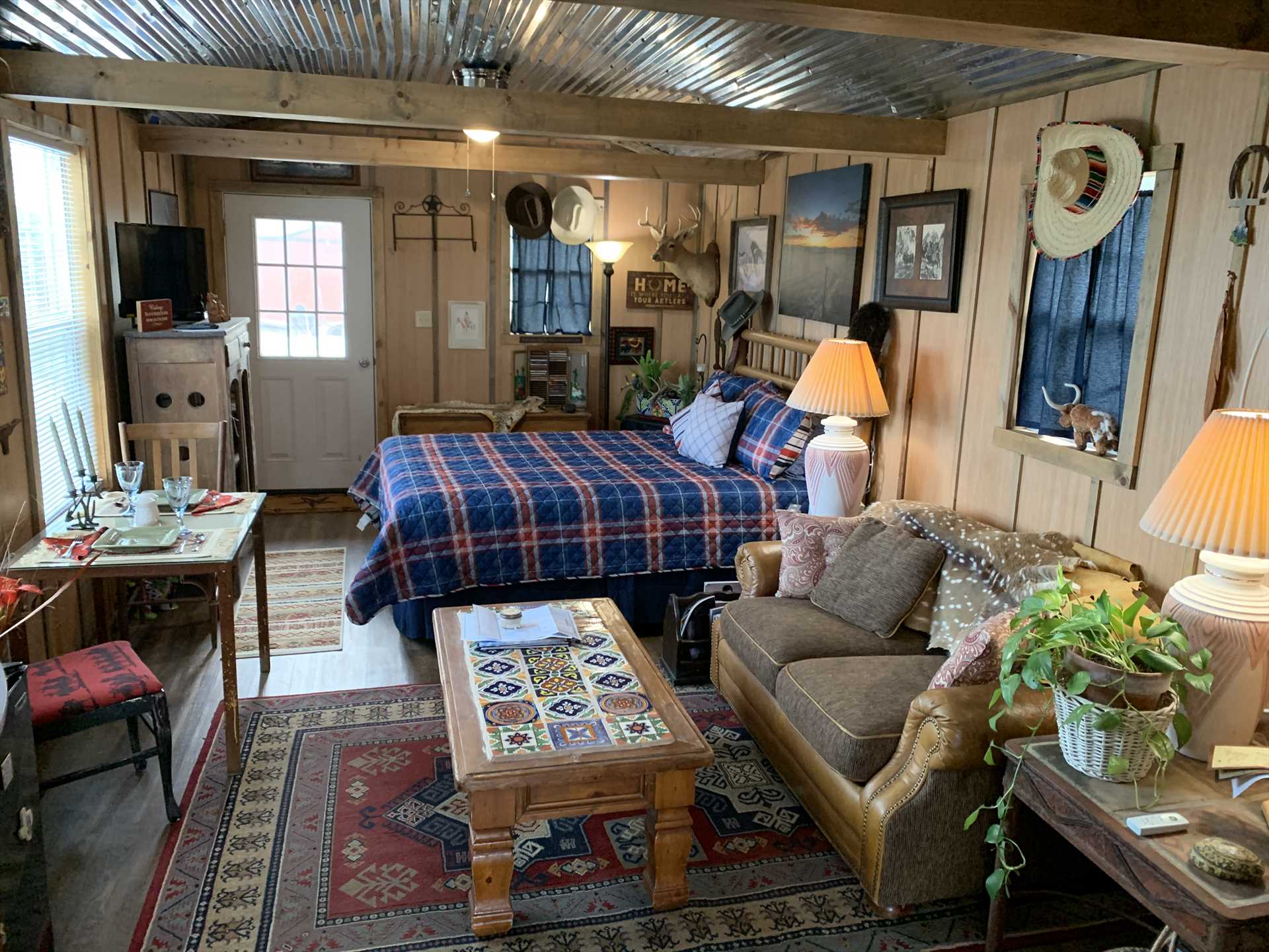                                                Cozy, eclectic, and flooded with natural light, the cabin sets the stage for an incredible romantic getaway!