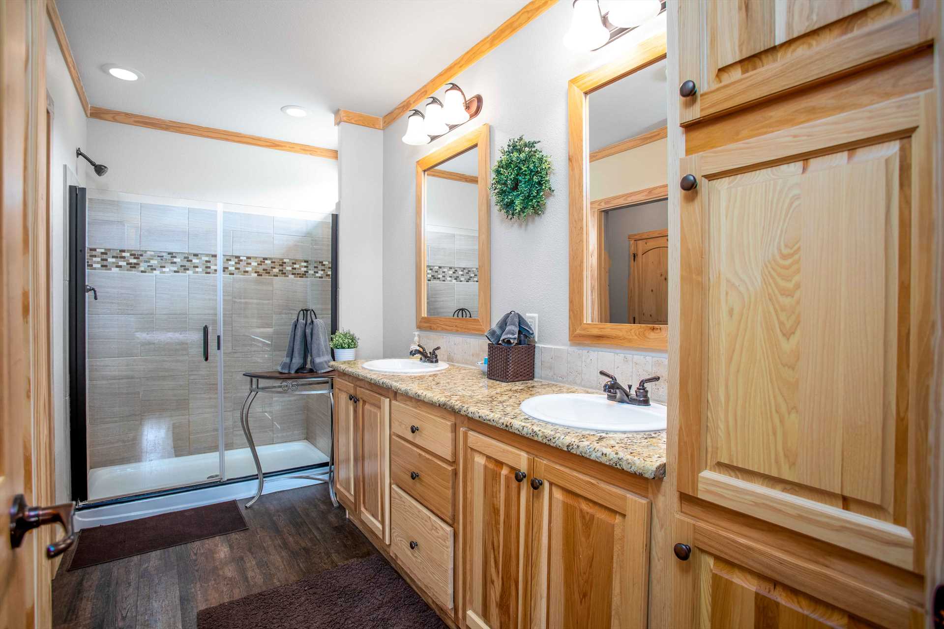                                                 Twin vanities, a shower, and a spacious closet are all available for your use in the master bathroom!