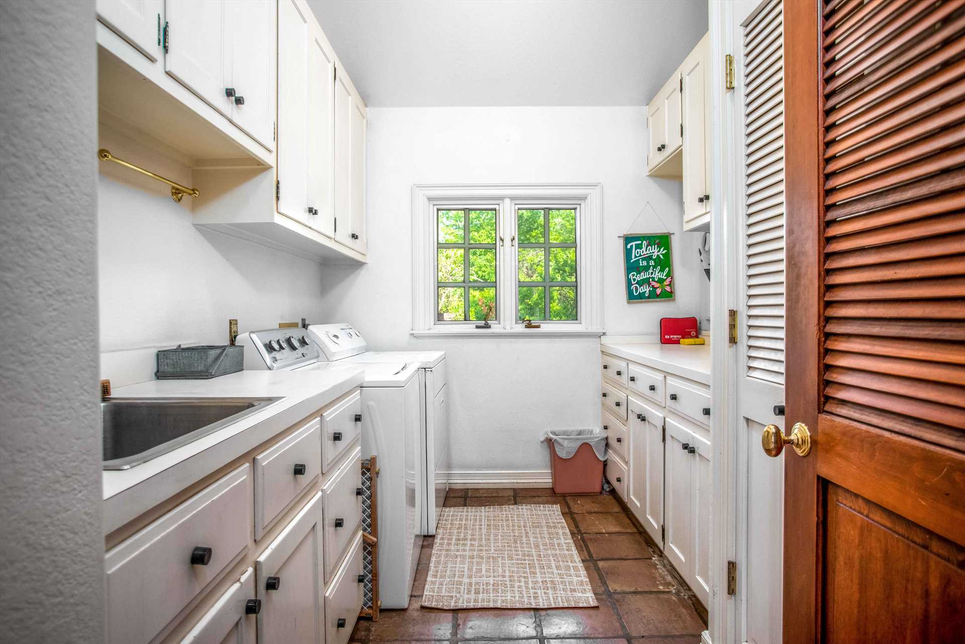                                                 Don't let laundry pile up and spoil your fun! The utility room at the Homestead has a sink, folding space, and a washer and dryer for your convenience.