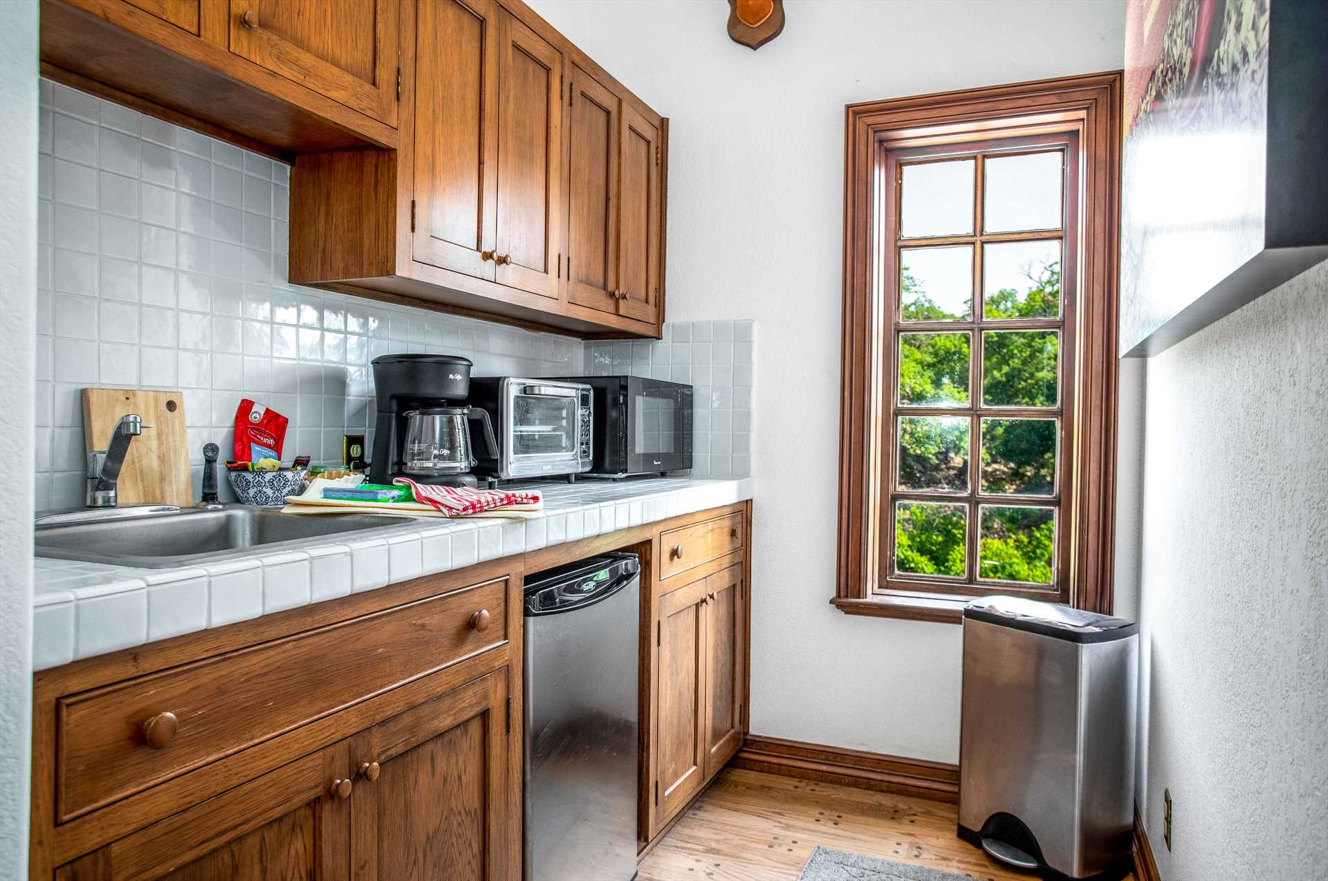                                                 The Casita's cozy kitchenette features a fridge, microwave, sink, toaster oven, and coffee maker!