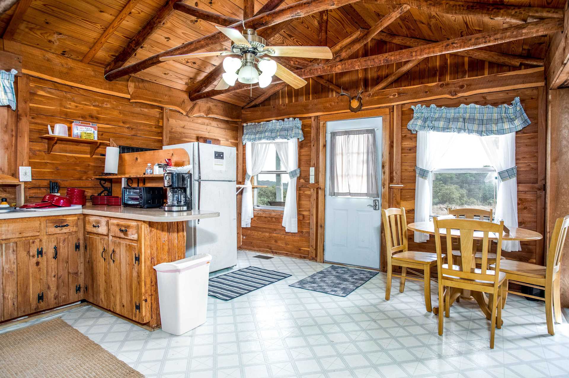                                                With wood furnishings, gleaming tile, and plenty of natural light, you almost expect Grandma to step out of the country kitchen with a warm plate of cookies!