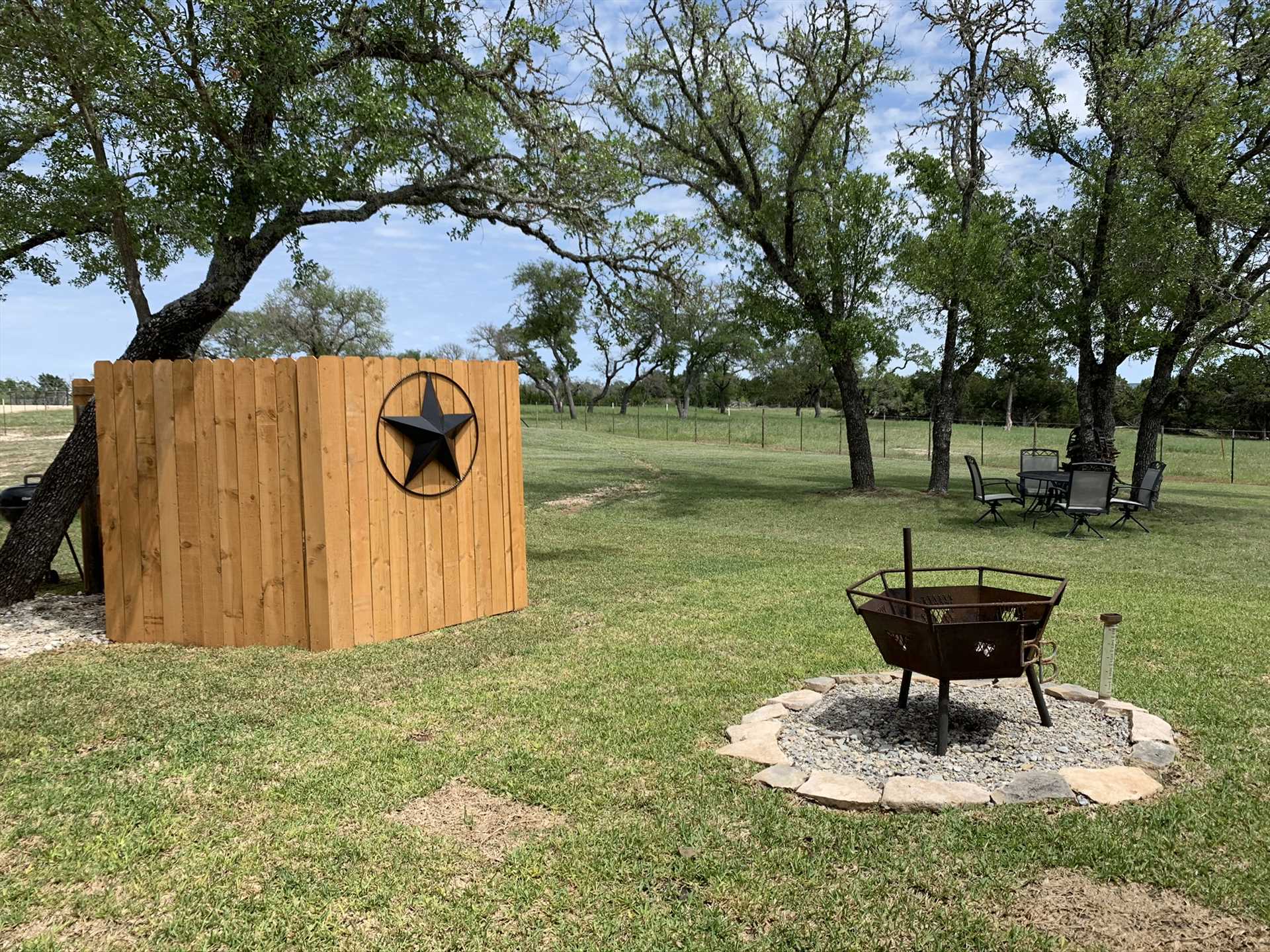                                                 A fire pit and charcoal grill out back make it easy to cook up something special outside! There are also corn hole bags and boards, and a telescope for checking out the Milky Way.