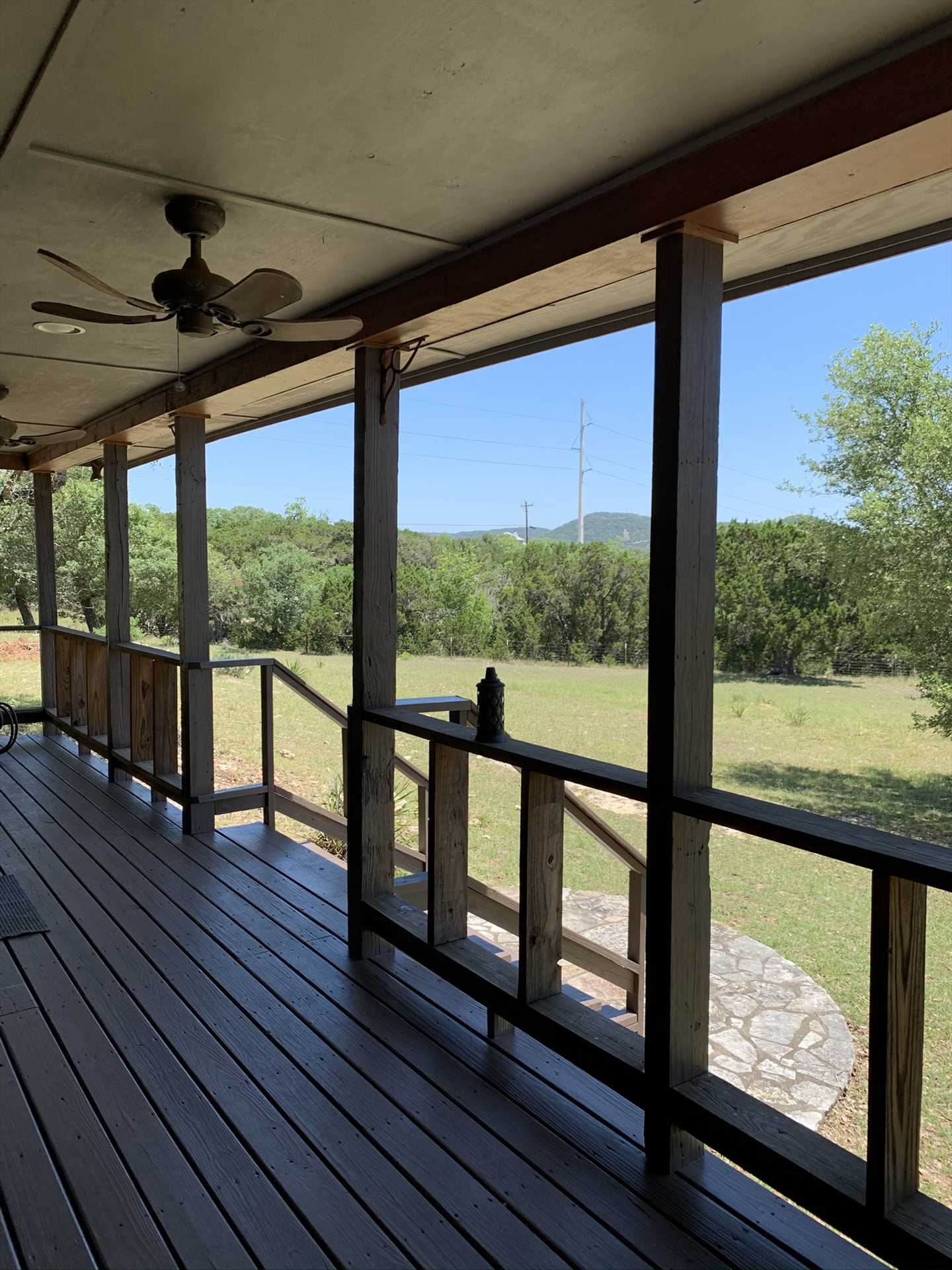                                                 Even on still days, you can stir up a Hill Country breeze on the shaded porch with the help of ceiling fans.